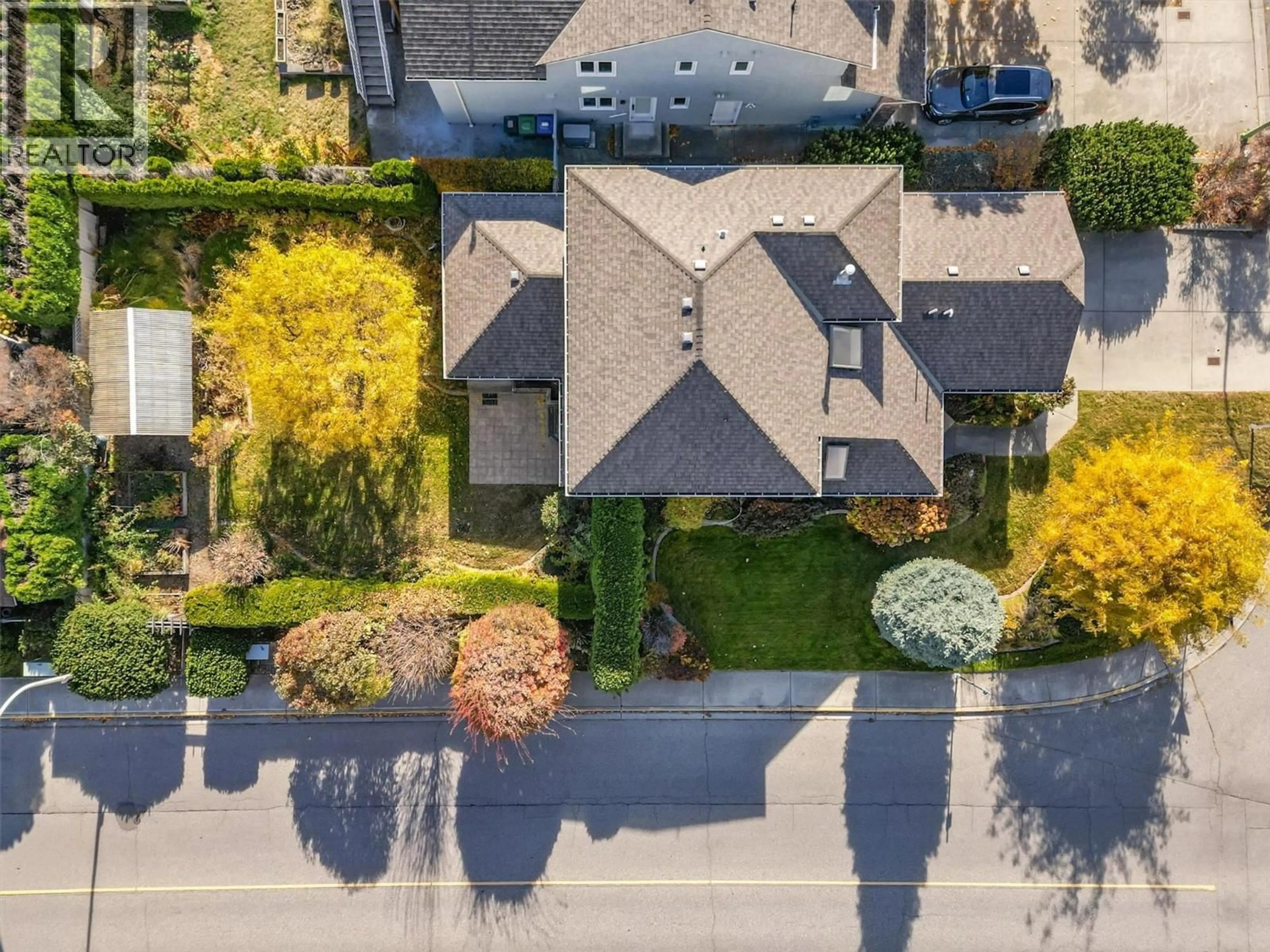 A pic from outside/outdoor area/front of a property/back of a property/a pic from drone, street for 4003 LOGIE COURT, Kelowna British Columbia V1W3Y6