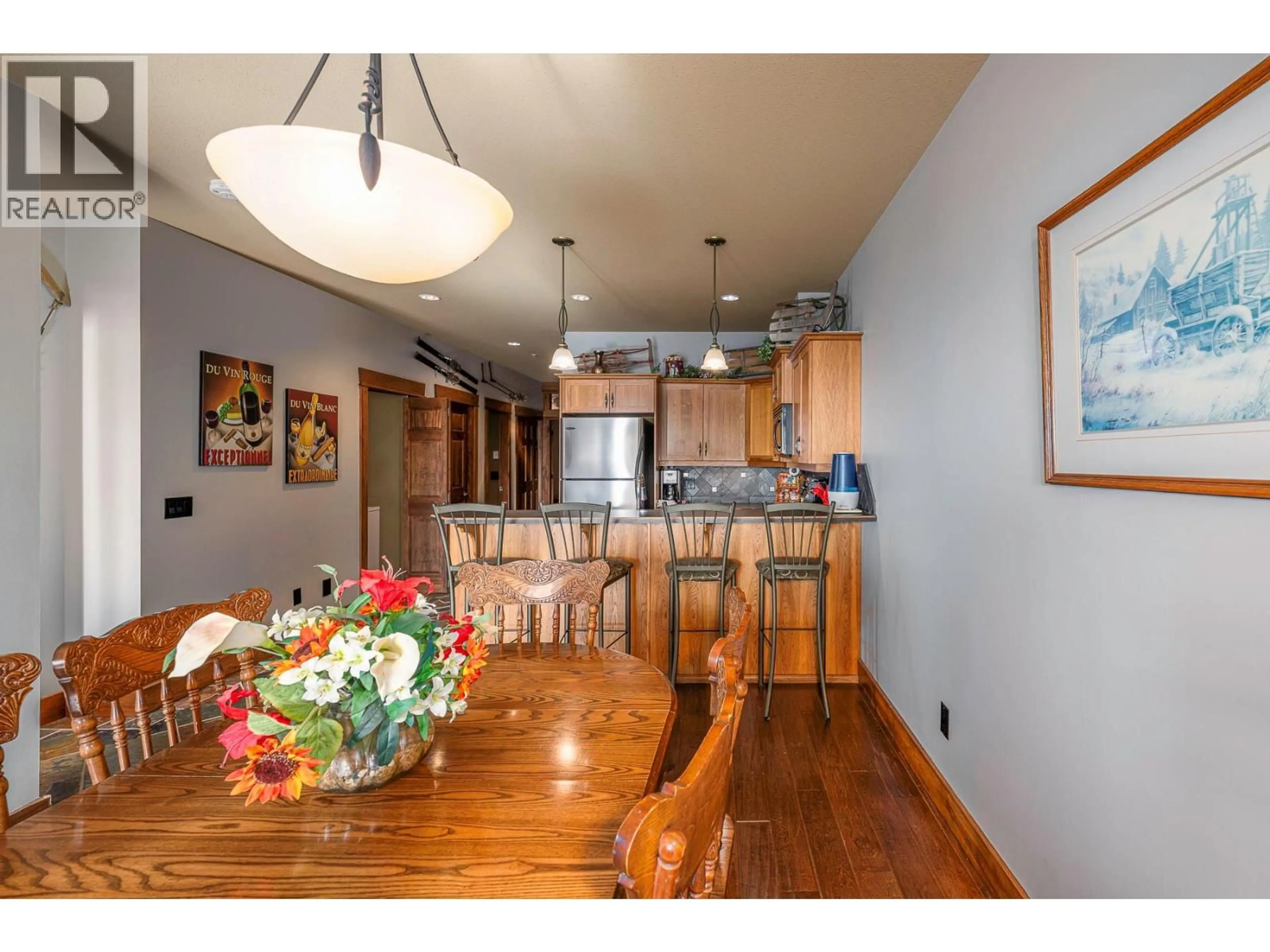 Open concept kitchen, wood/laminate floor for 3 - 7360 PORCUPINE ROAD, Big White British Columbia V1P1P3