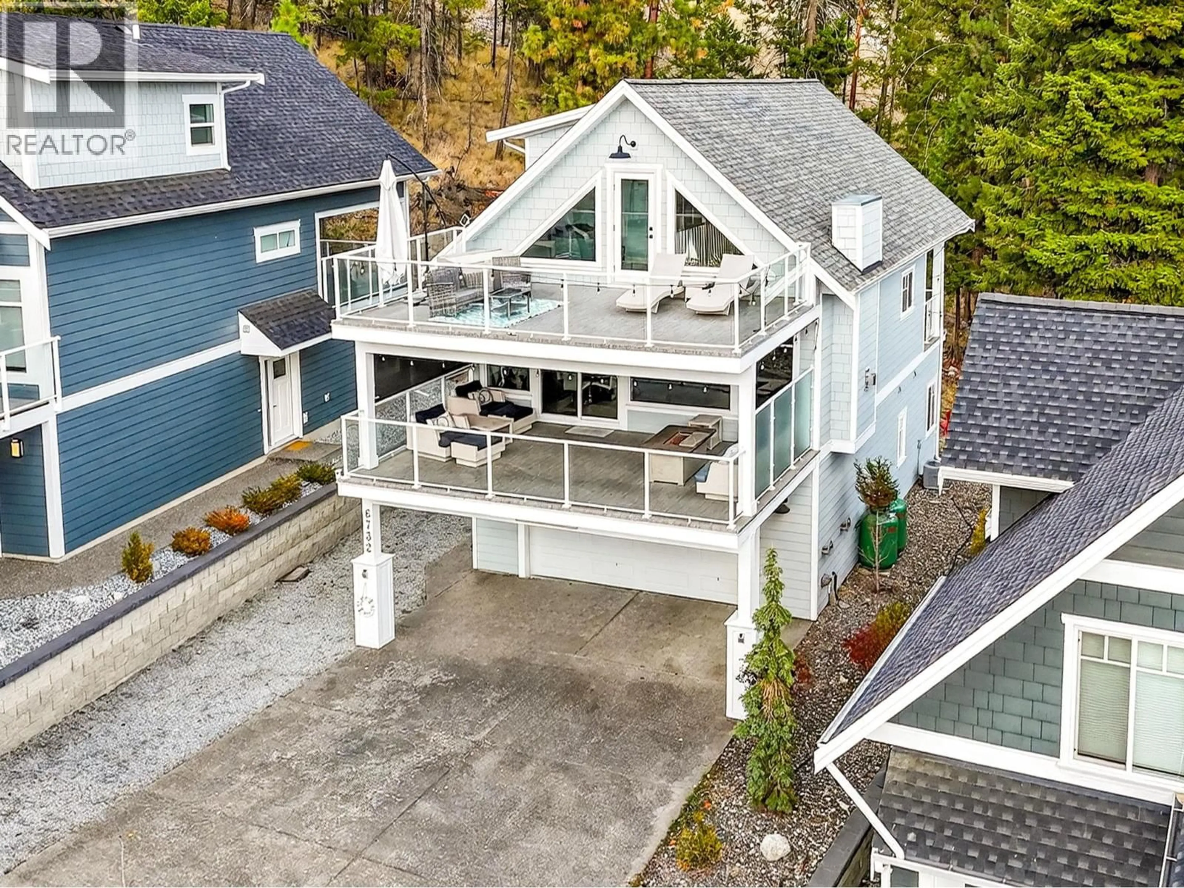 A pic from outside/outdoor area/front of a property/back of a property/a pic from drone, unknown for 213 - 6732 LAPALMA LOOP, Kelowna British Columbia V1Z3R8