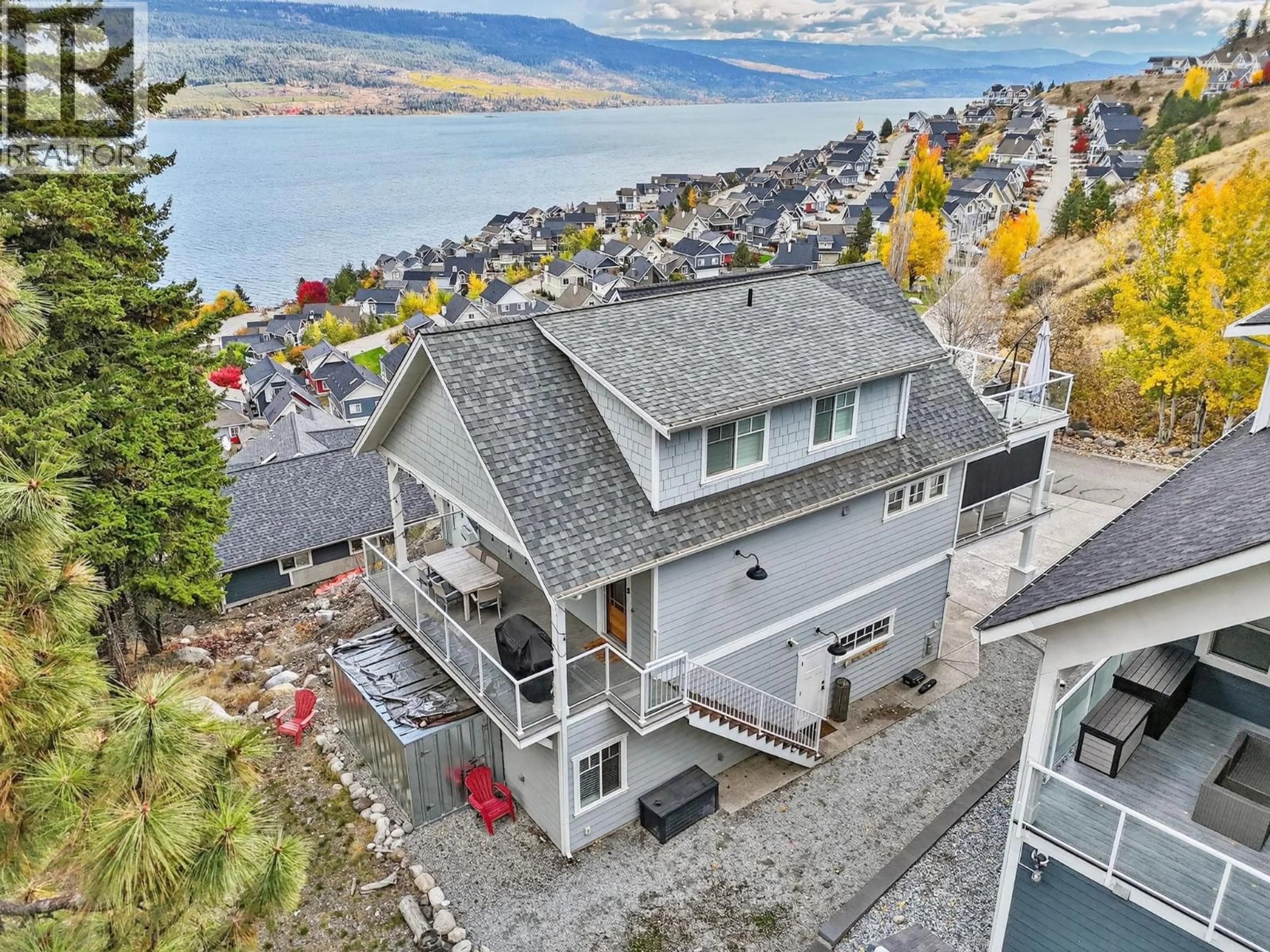 A pic from outside/outdoor area/front of a property/back of a property/a pic from drone, water/lake/river/ocean view for 213 - 6732 LAPALMA LOOP, Kelowna British Columbia V1Z3R8