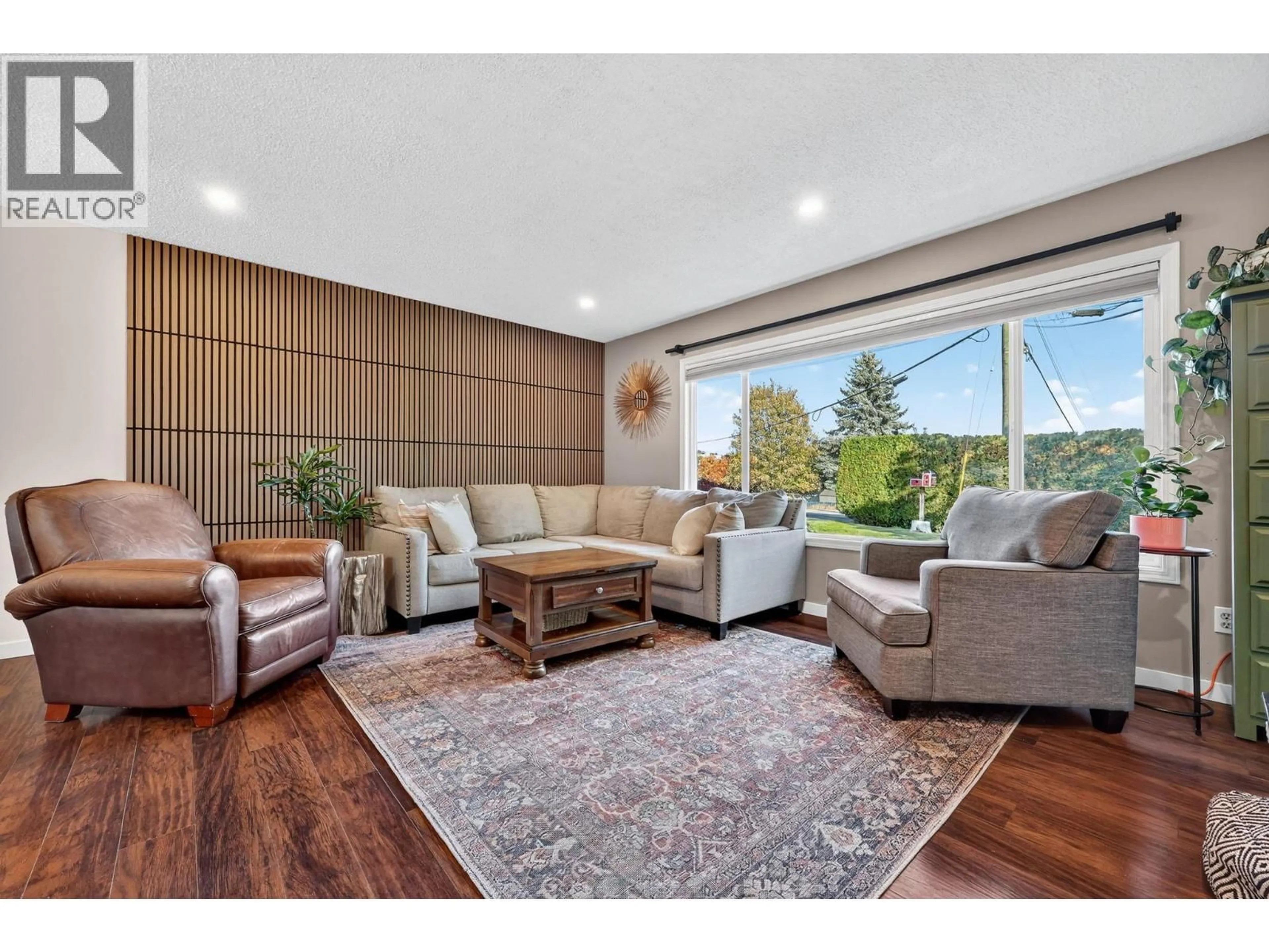 Living room with furniture, wood/laminate floor for 3454 LOGAN ROAD, West Kelowna British Columbia V4T1N6