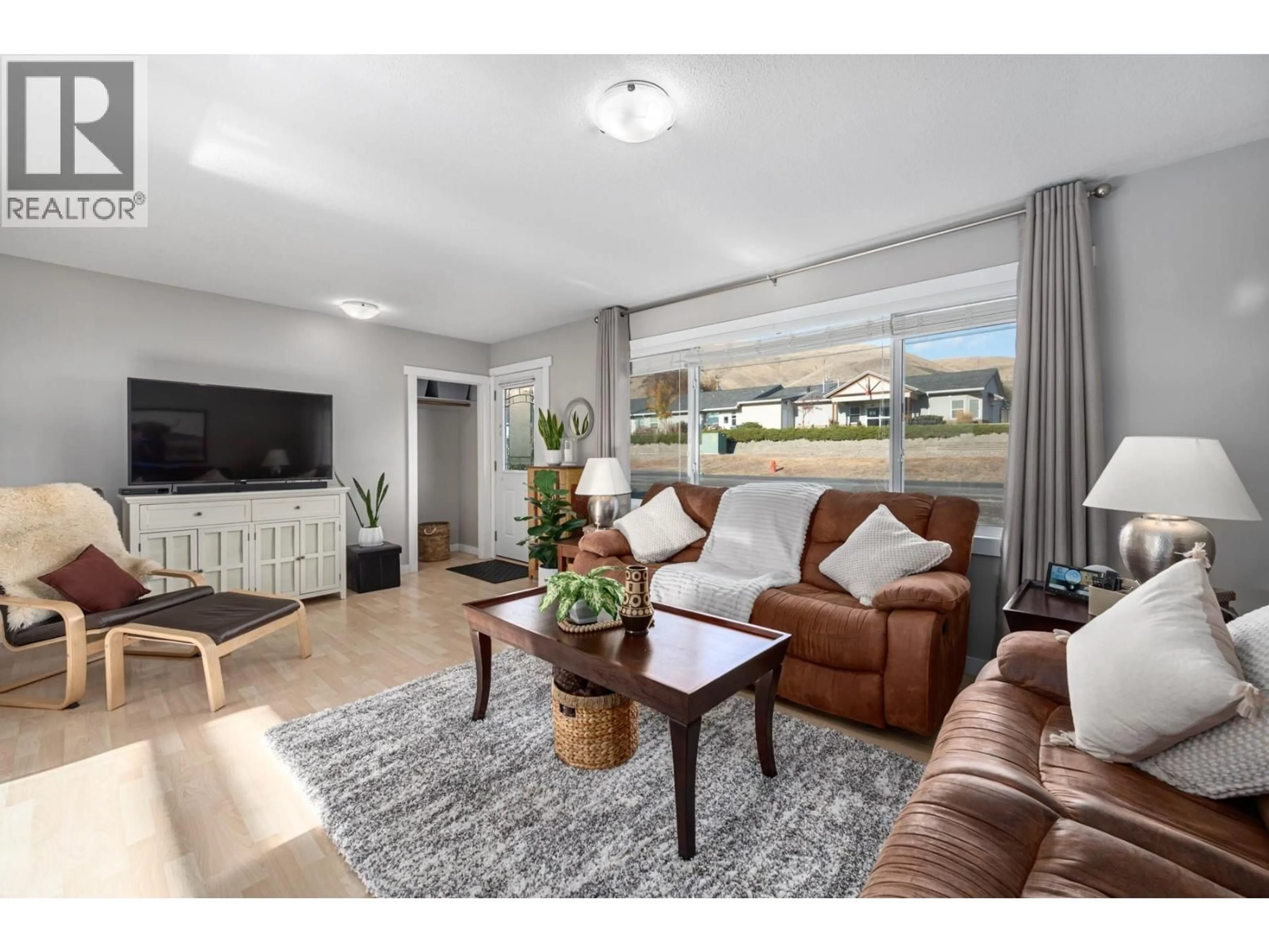 Living room with furniture, wood/laminate floor for 705 ELM STREET, Ashcroft British Columbia V0K1A0