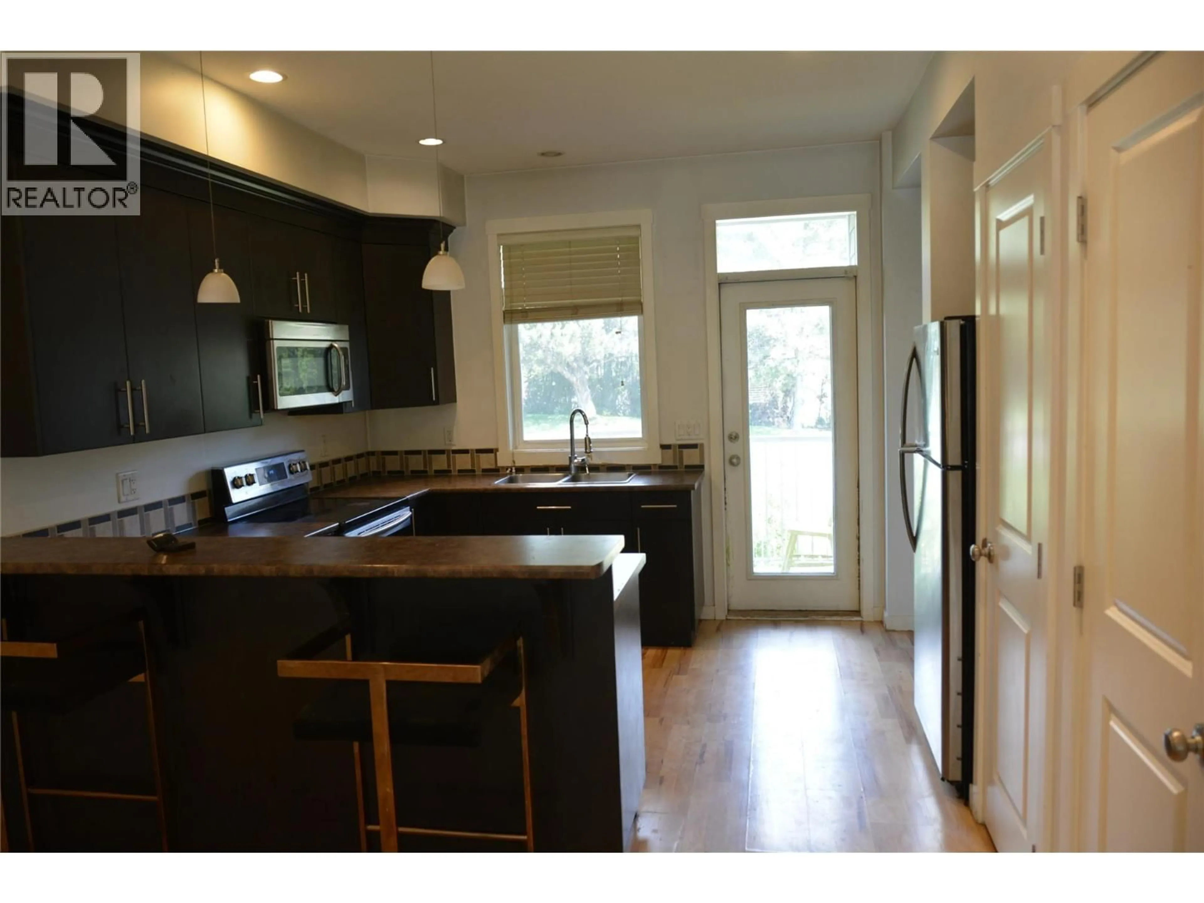 Open concept kitchen, wood/laminate floor for 25 - 2860 VALLEYVIEW DRIVE, Kamloops British Columbia V2C0B3