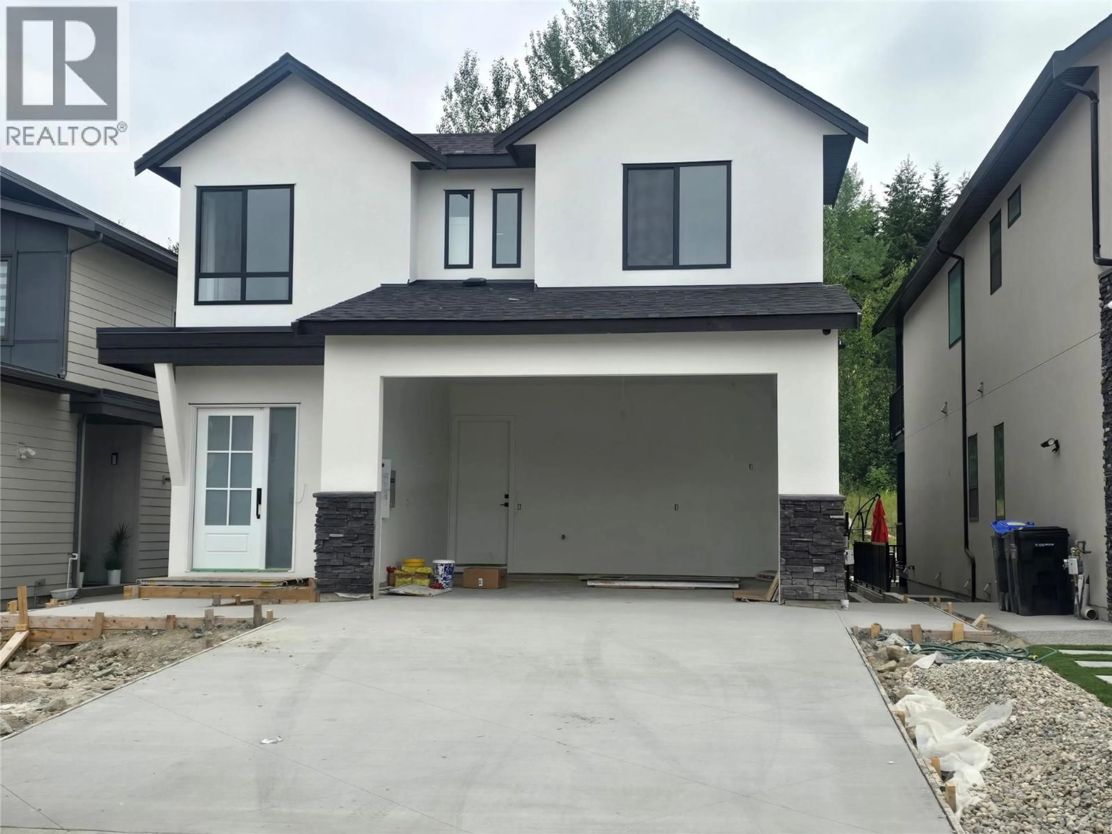 Home with brick exterior material, street for 996 BULL CRESCENT, Kelowna British Columbia V1W0B6