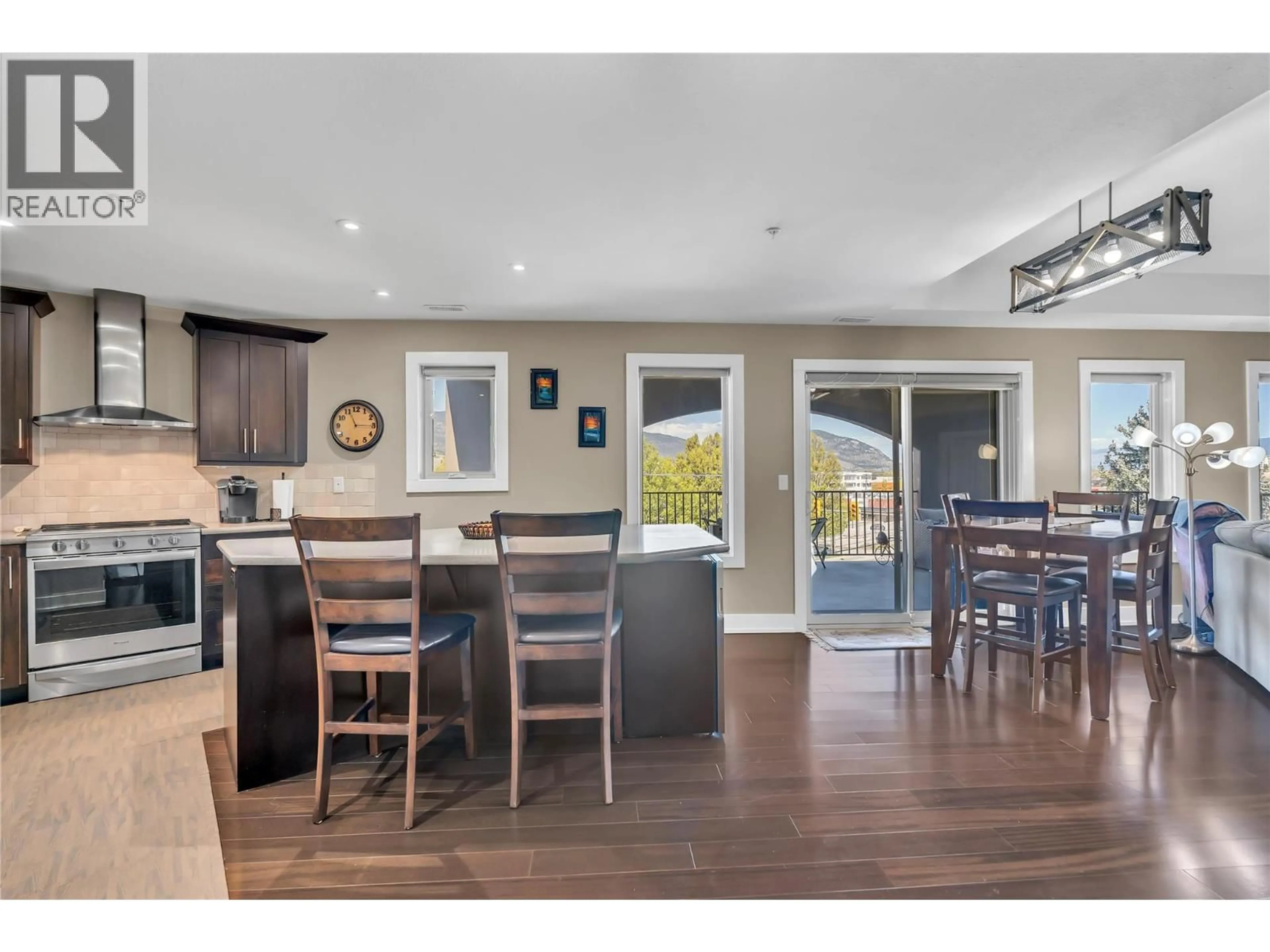 Open concept kitchen, wood/laminate floor for 302 - 250 WATERFORD AVENUE, Penticton British Columbia V2A3T8