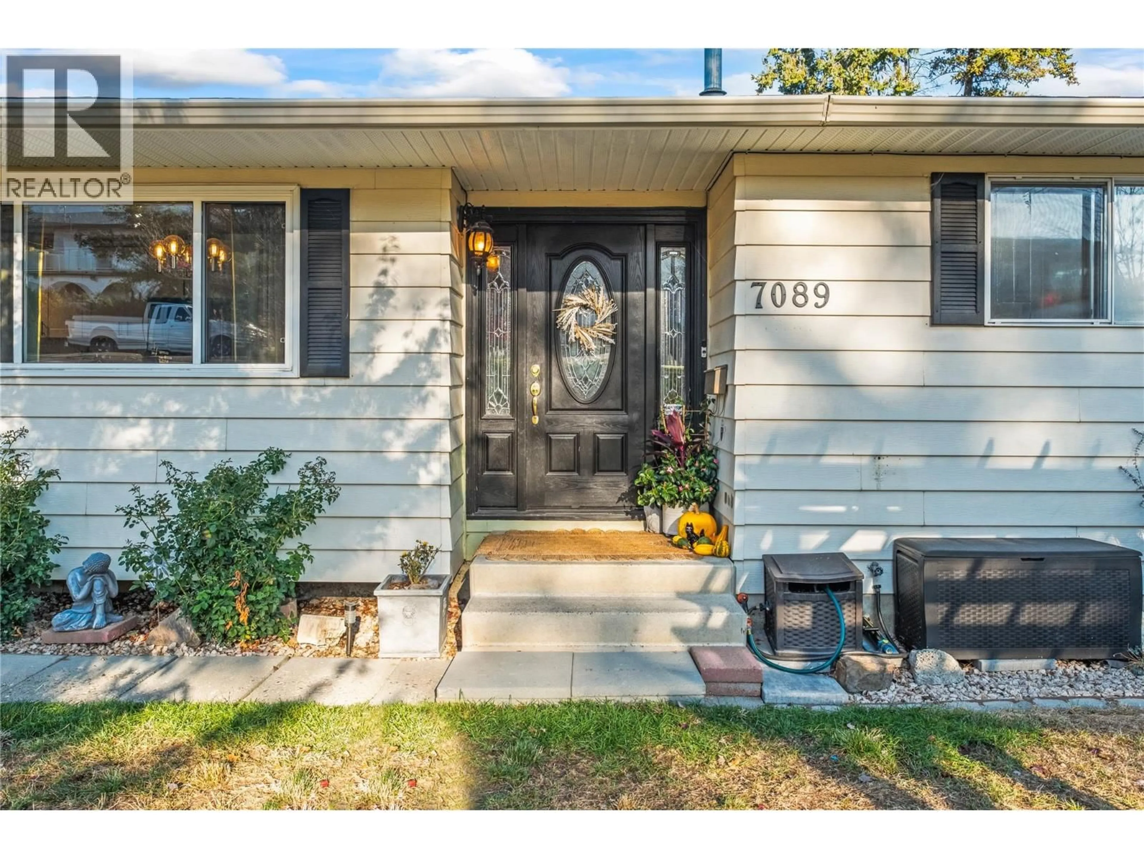 Home with vinyl exterior material, street for 7089 LONGACRE DRIVE, Vernon British Columbia V1H1H8