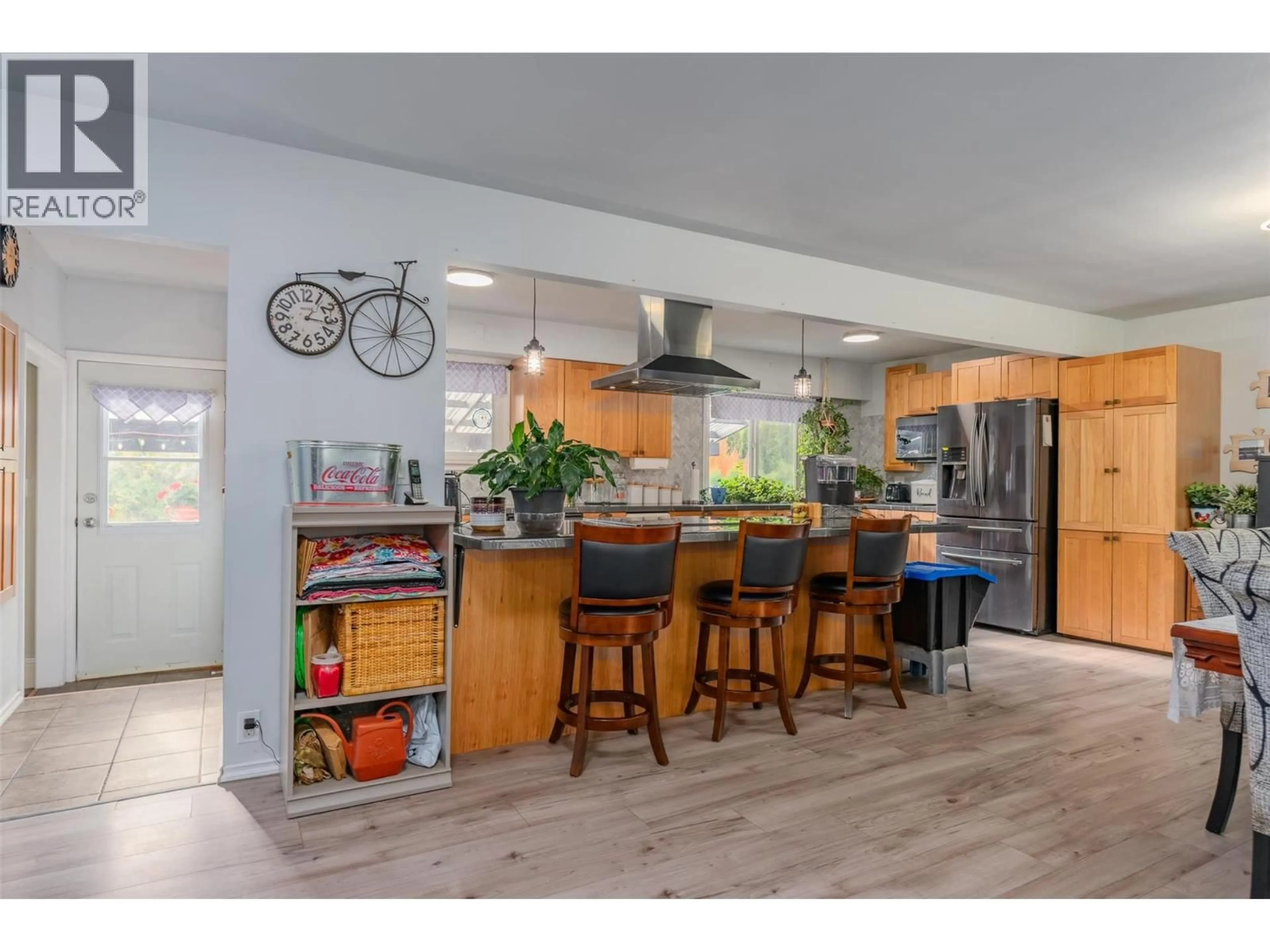 Open concept kitchen, wood/laminate floor for 8329 HIGHWAY 3B OTHER, Trail British Columbia V1R4W3