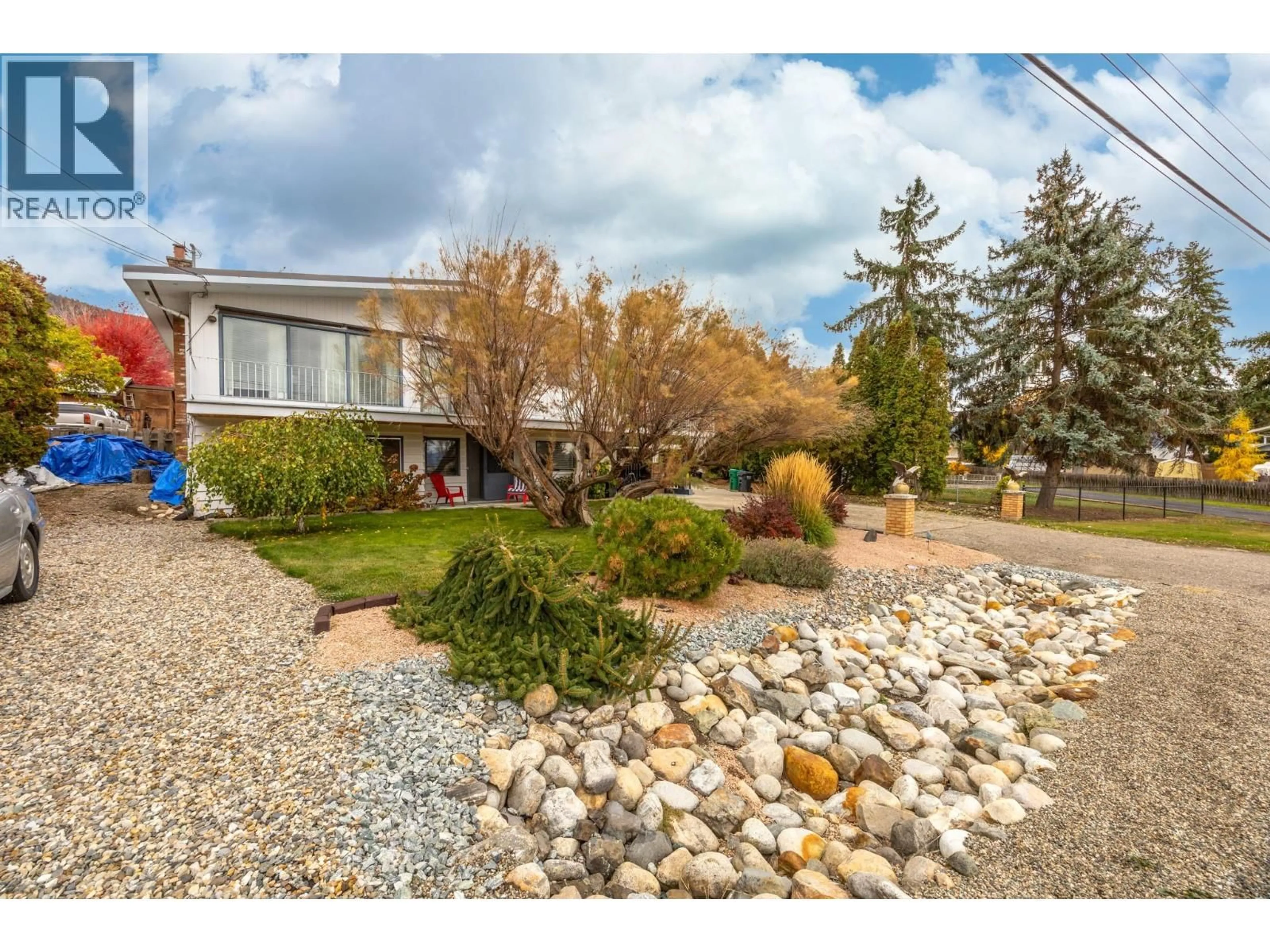 A pic from outside/outdoor area/front of a property/back of a property/a pic from drone, street for 647 DOWNIE ROAD, Vernon British Columbia V1B3A9