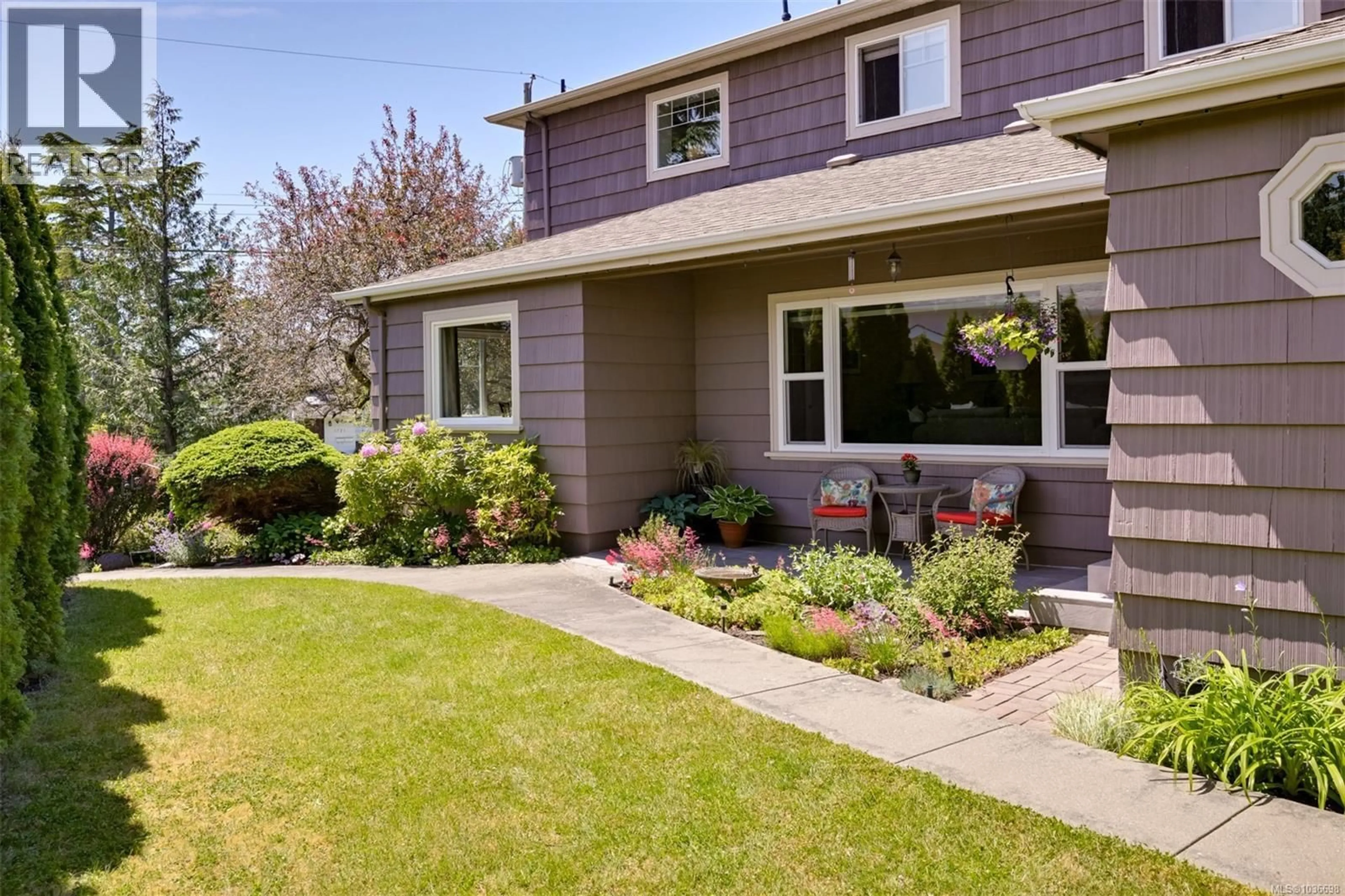 Home with vinyl exterior material, street for 1718 GARNET ROAD, Saanich British Columbia V8P3C8