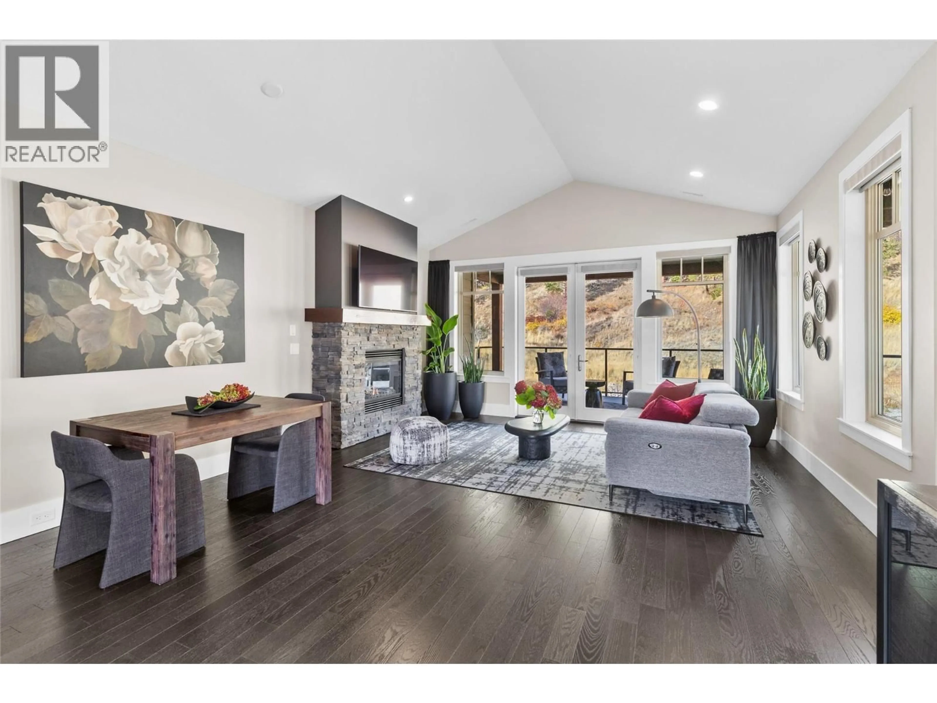 Living room with furniture, wood/laminate floor for 221 - 4000 REDSTONE CRESCENT, Peachland British Columbia V0H1X5