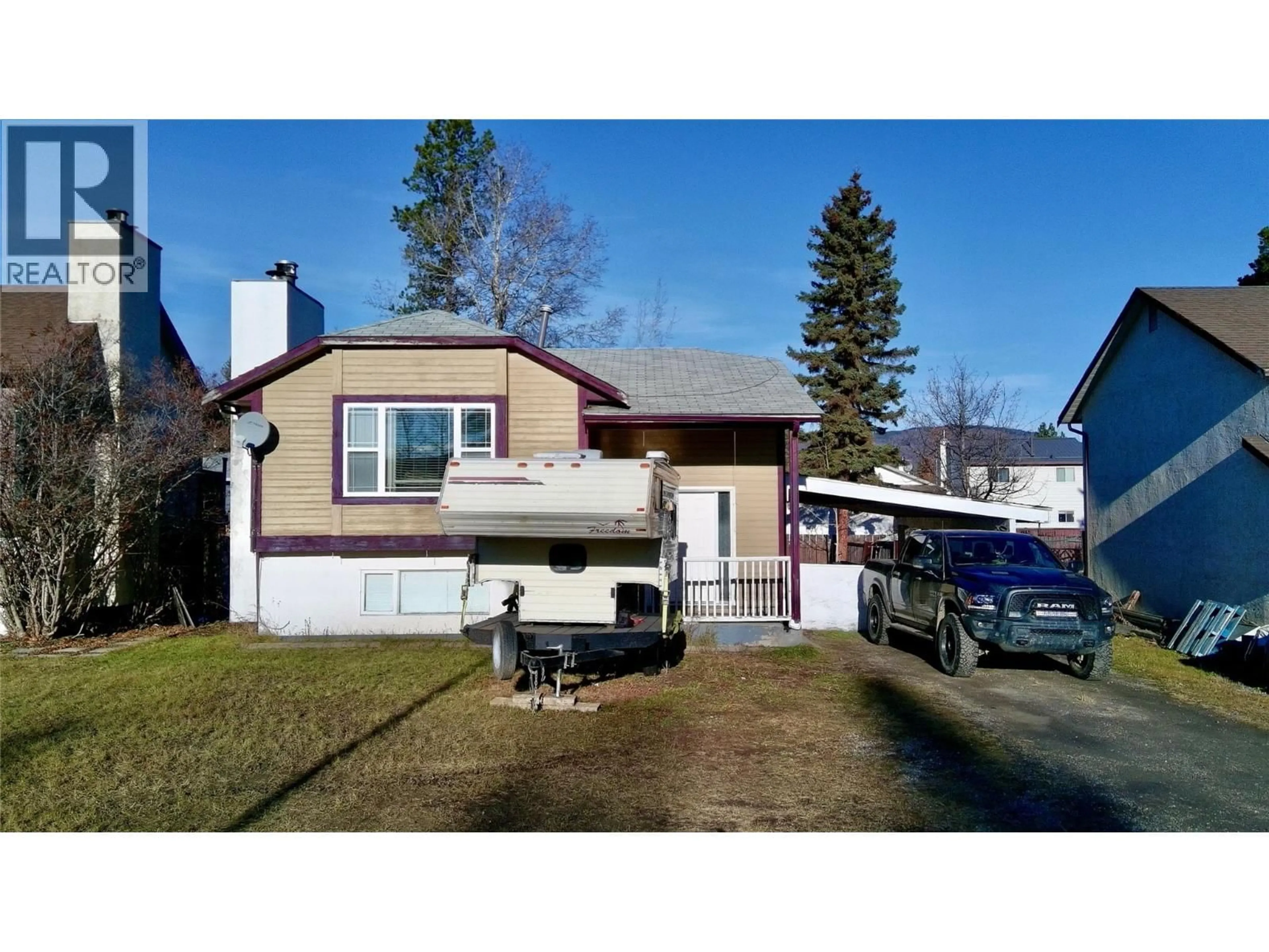 Home with vinyl exterior material, street for 128 PEACE RIVER CRESCENT, Tumbler Ridge British Columbia V0C2W0