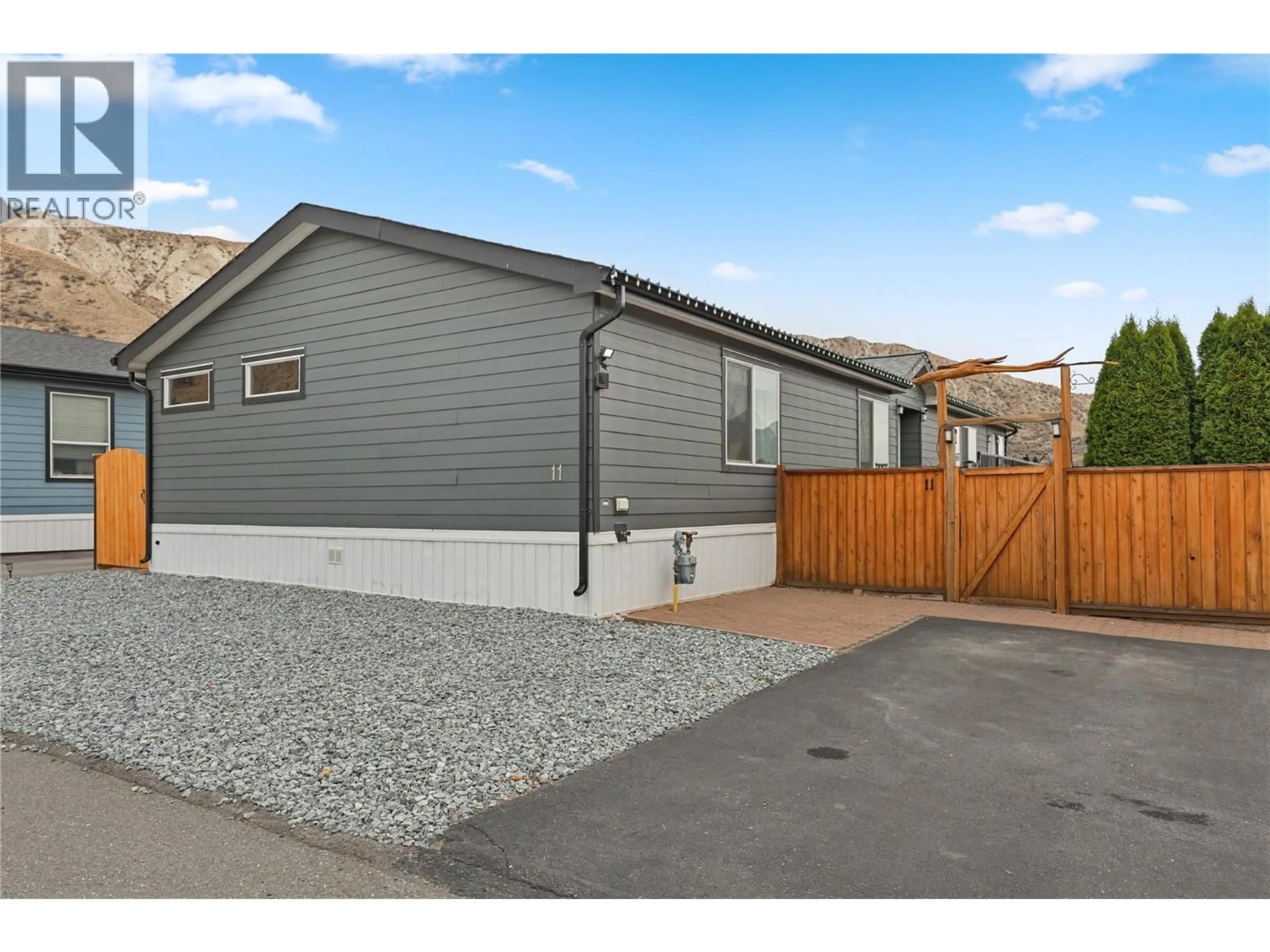Home with vinyl exterior material, street for 11 - 712 SHUSWAP  E ROAD, Kamloops British Columbia V2H0C8