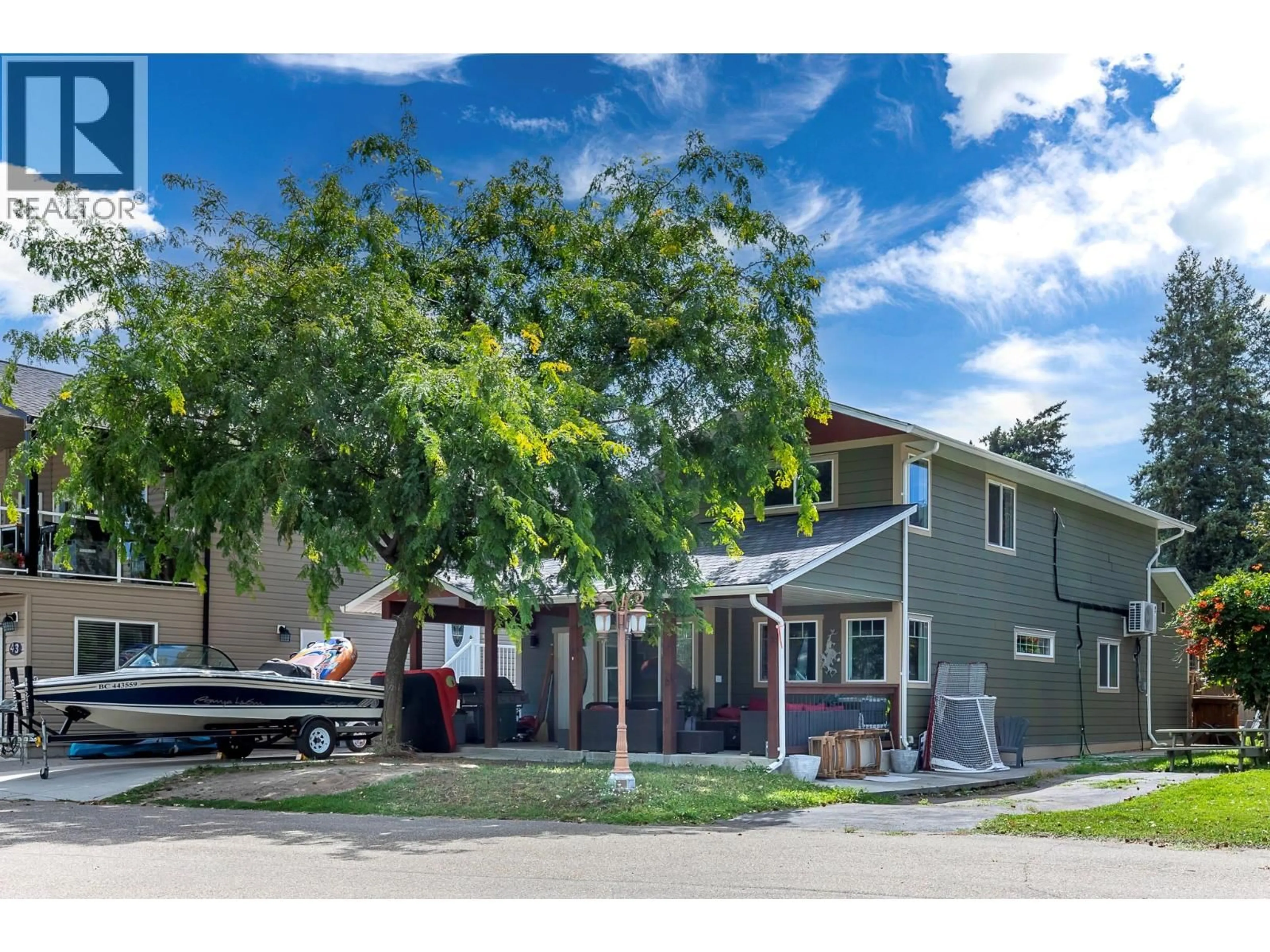 A pic from outside/outdoor area/front of a property/back of a property/a pic from drone, street for 42 LAKESHORE DRIVE, Vernon British Columbia V1H2A1