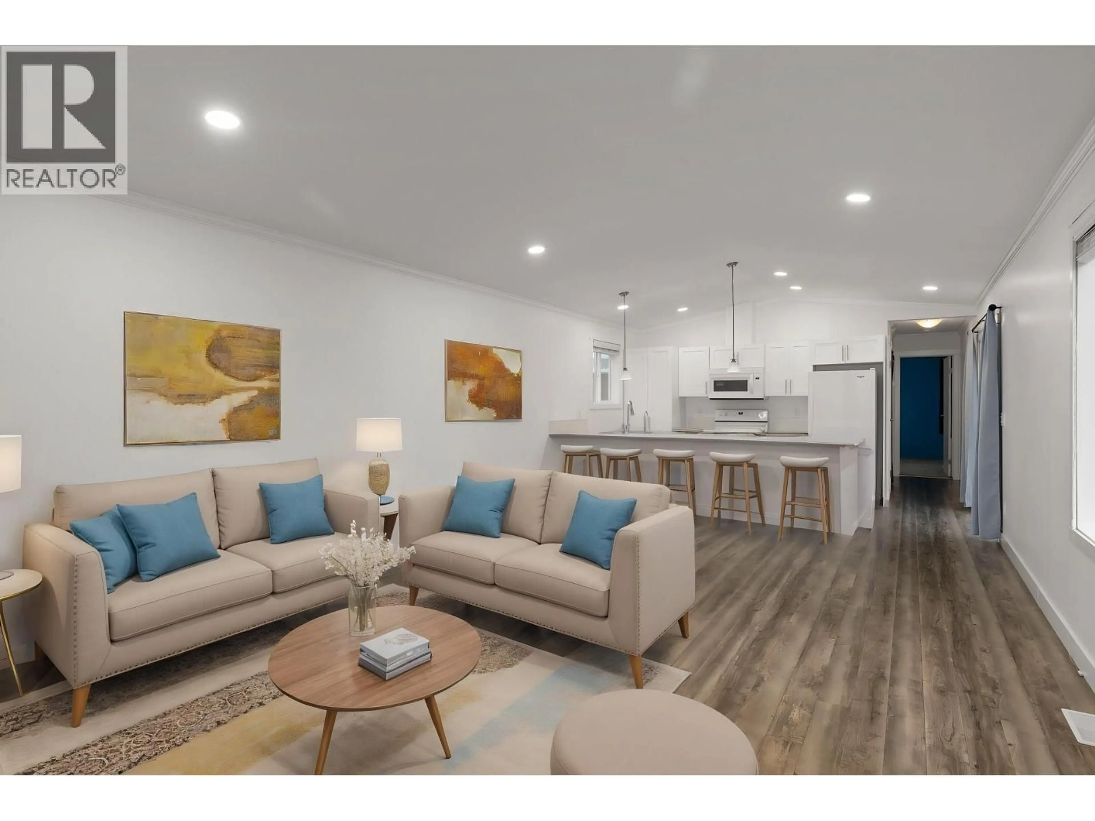 Living room with furniture, wood/laminate floor for 148 - 9020 JIM BAILEY ROAD, Kelowna British Columbia V4V1E5