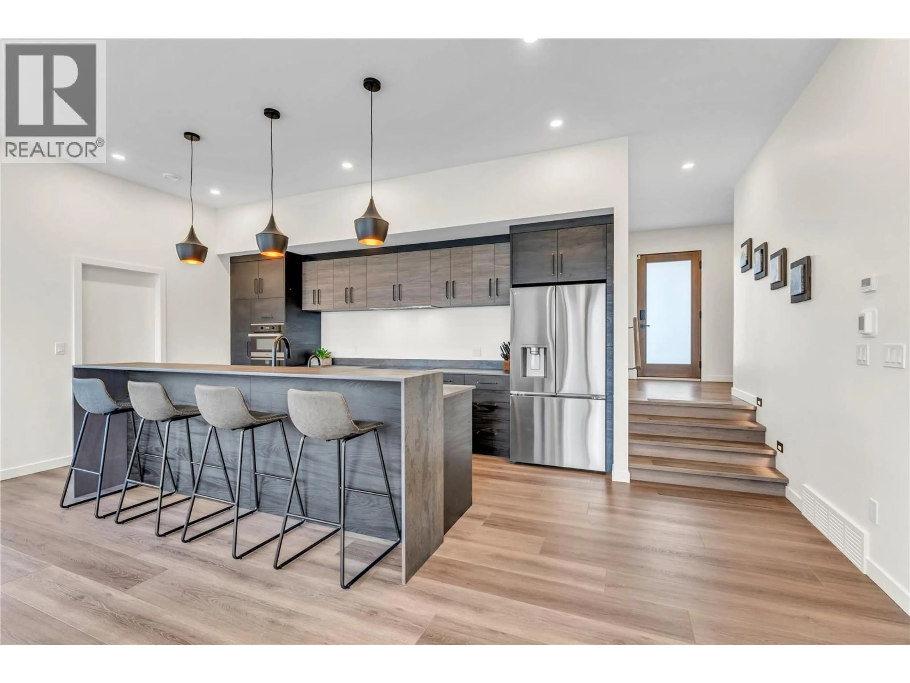 Open concept kitchen, wood/laminate floor for 117 - 3331 EVERGREEN DRIVE, Penticton British Columbia V2A0J3