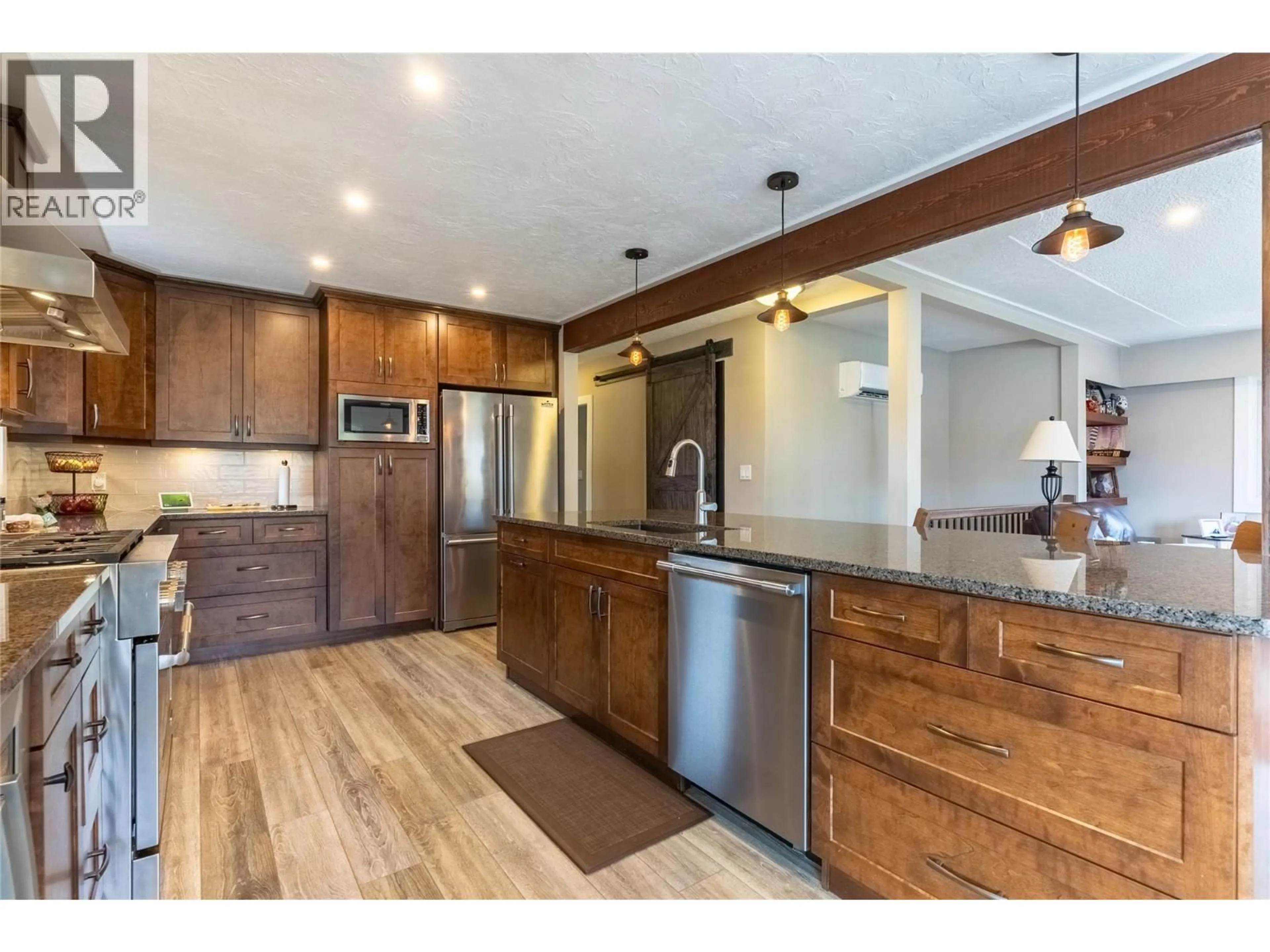 Open concept kitchen, wood/laminate floor for 725 YATES ROAD, Kamloops British Columbia V2B6E1