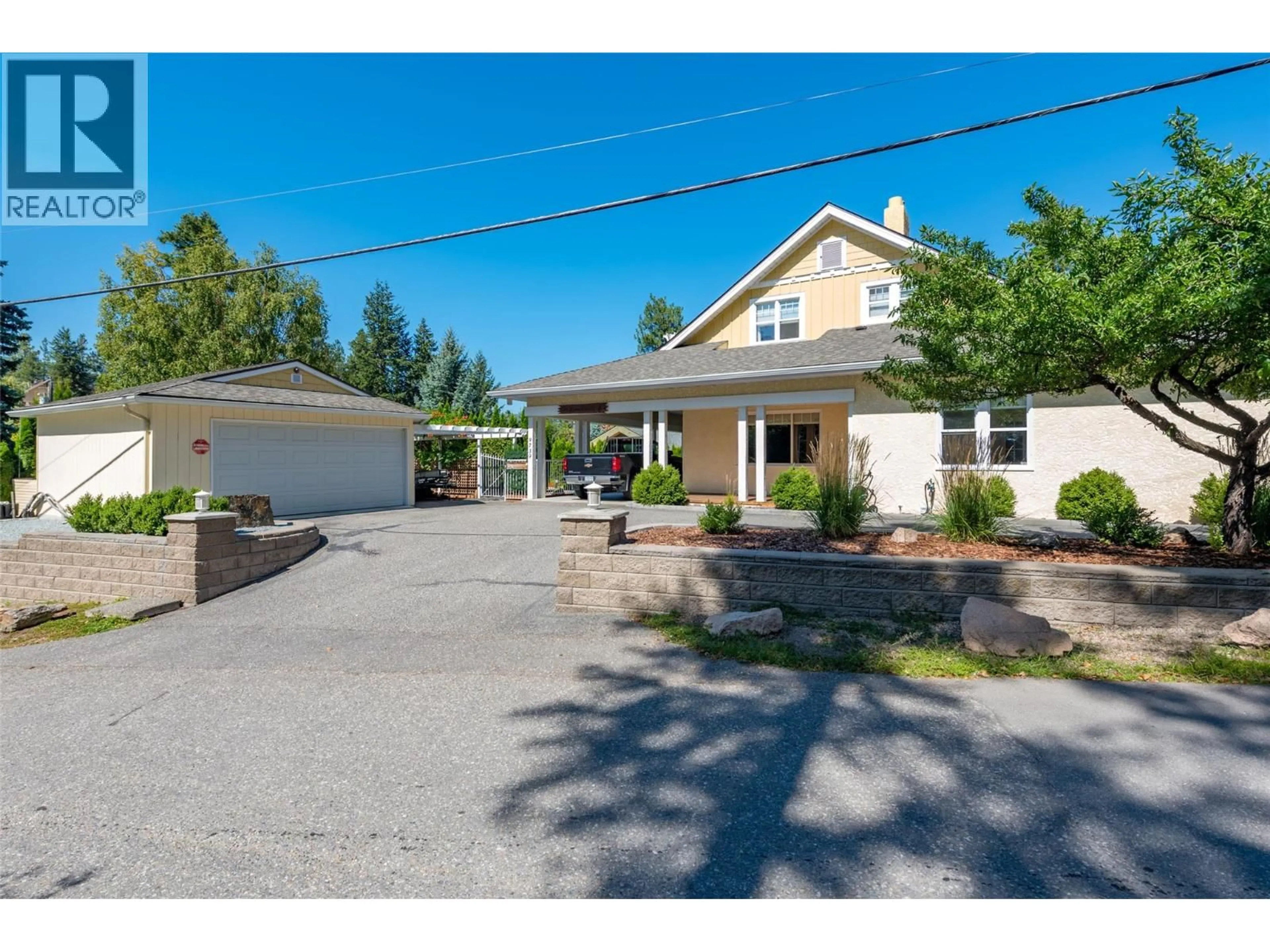 A pic from outside/outdoor area/front of a property/back of a property/a pic from drone, street for 9739 DELCLIFFE ROAD, Vernon British Columbia V1H1K9