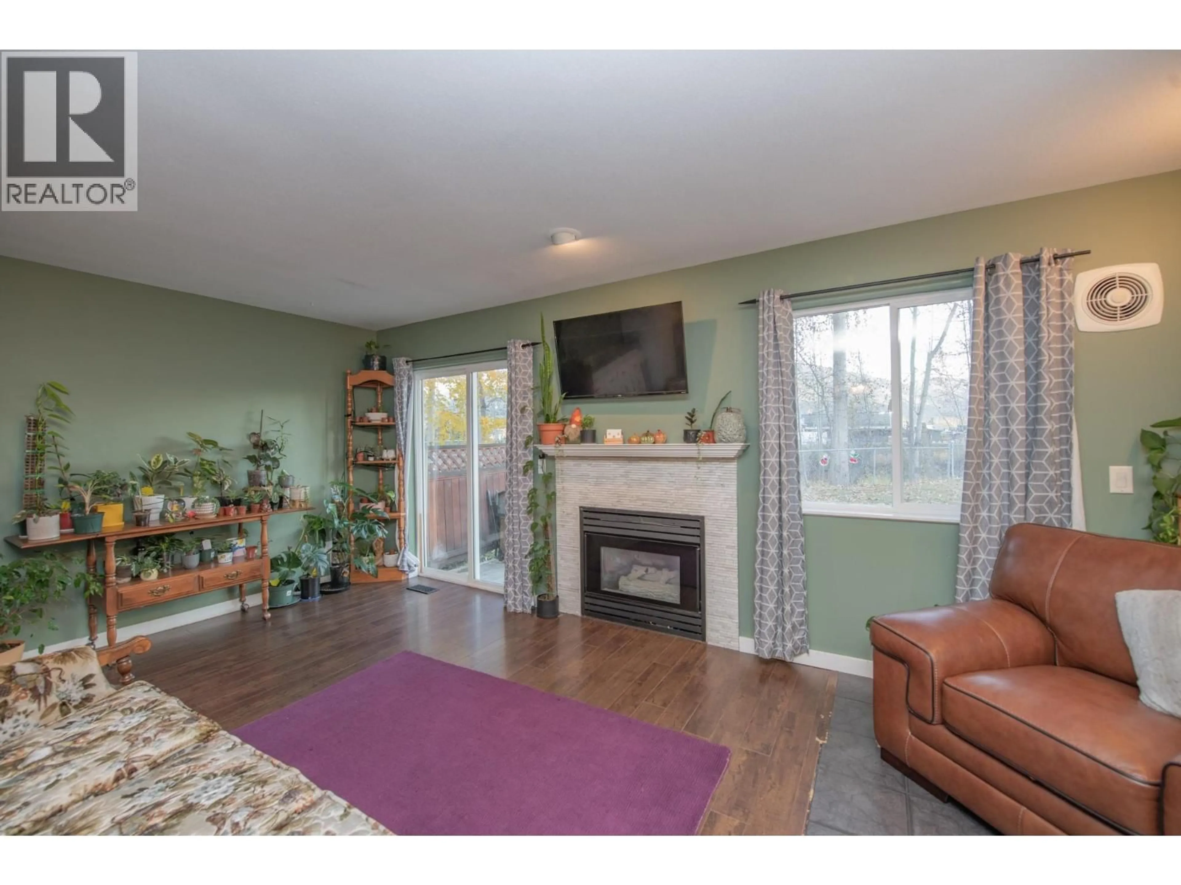 Living room with furniture, wood/laminate floor for 11 - 2156 BESSETTE STREET, Lumby British Columbia V0E2G0