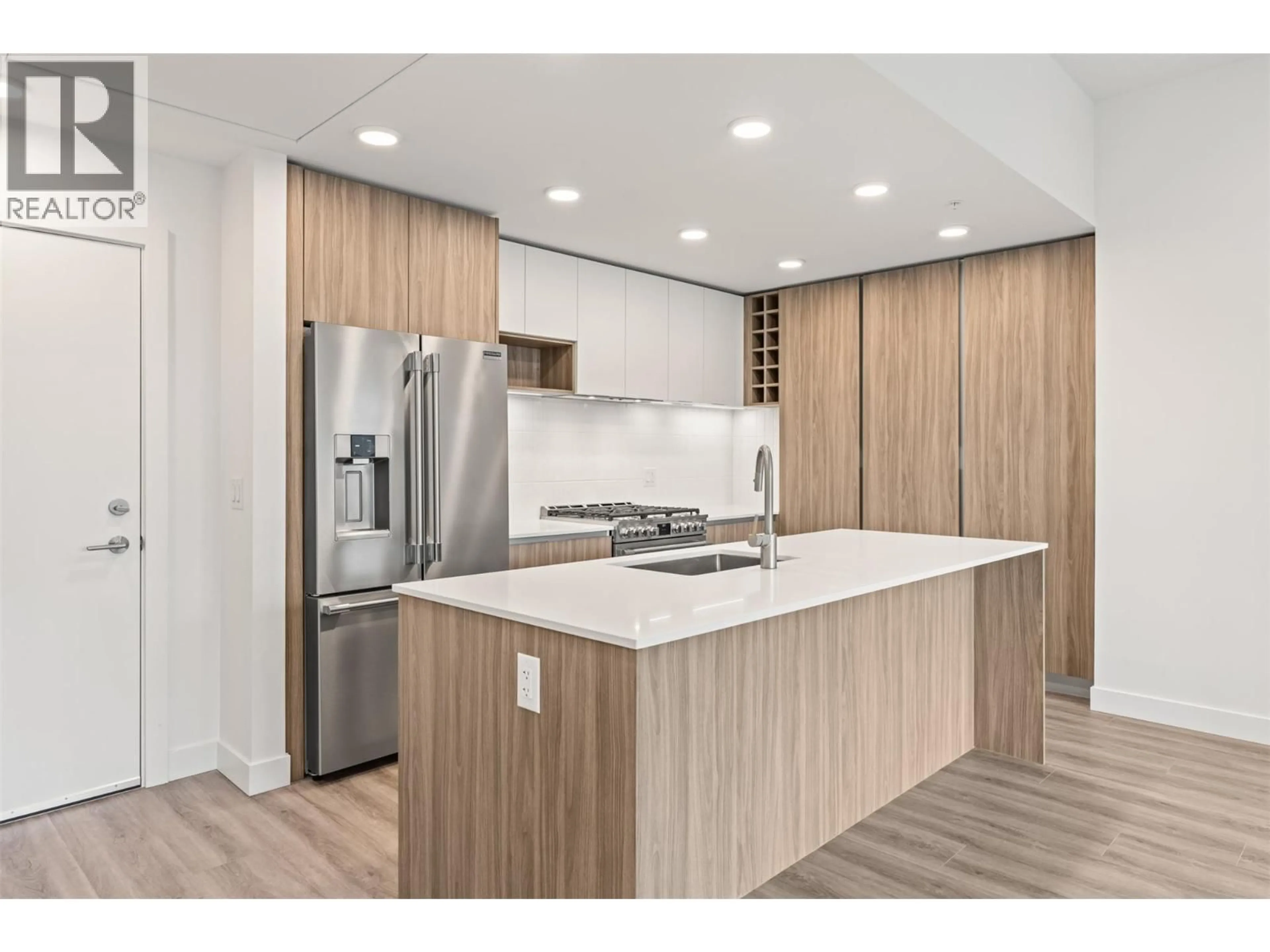 Open concept kitchen, wood/laminate floor for 604 - 2760 OLALLA ROAD, West Kelowna British Columbia V1Z2A9