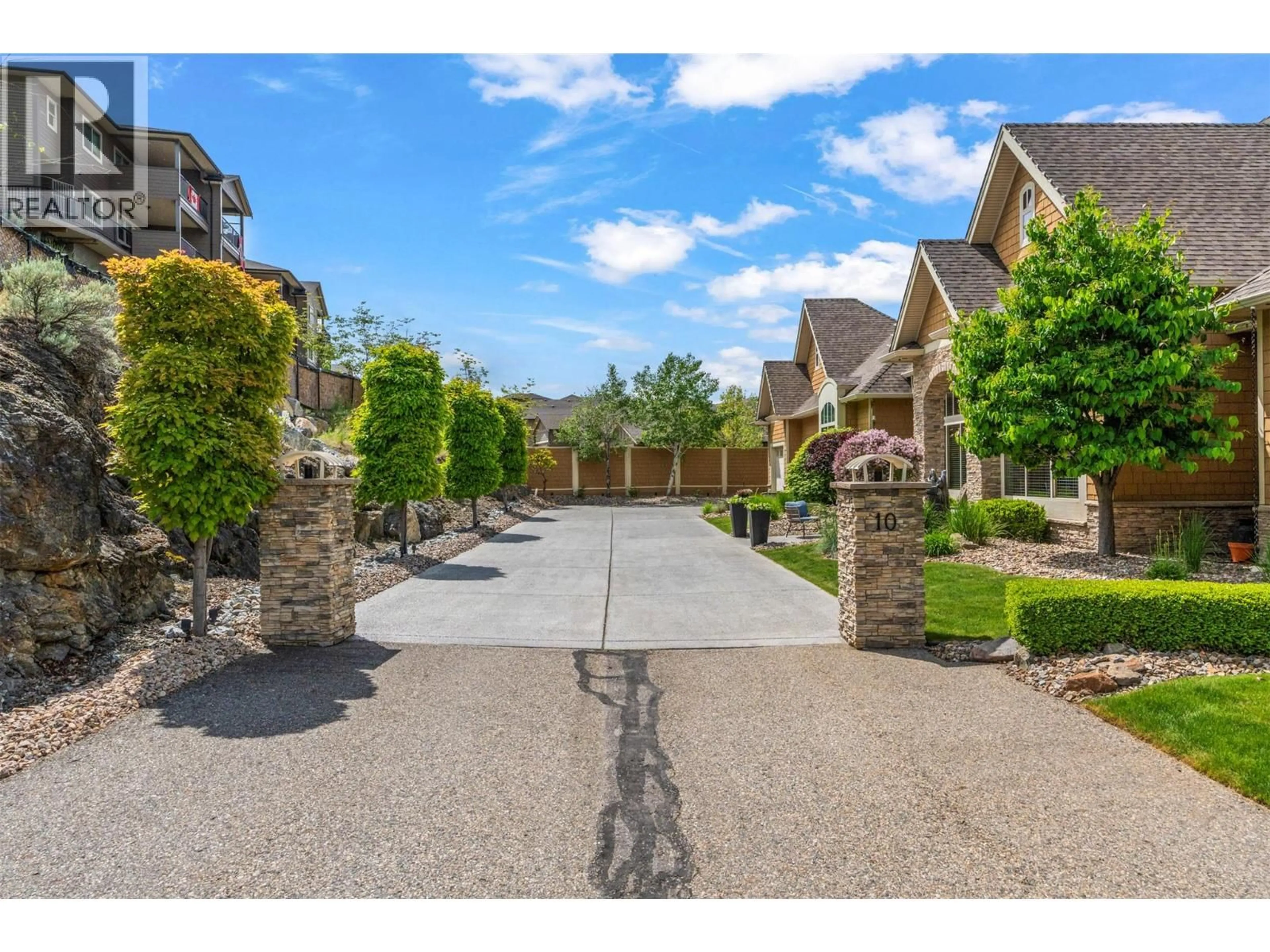 A pic from outside/outdoor area/front of a property/back of a property/a pic from drone, street for 10 - 1117 MT FOSTHALL DRIVE, Vernon British Columbia V1B3Z9