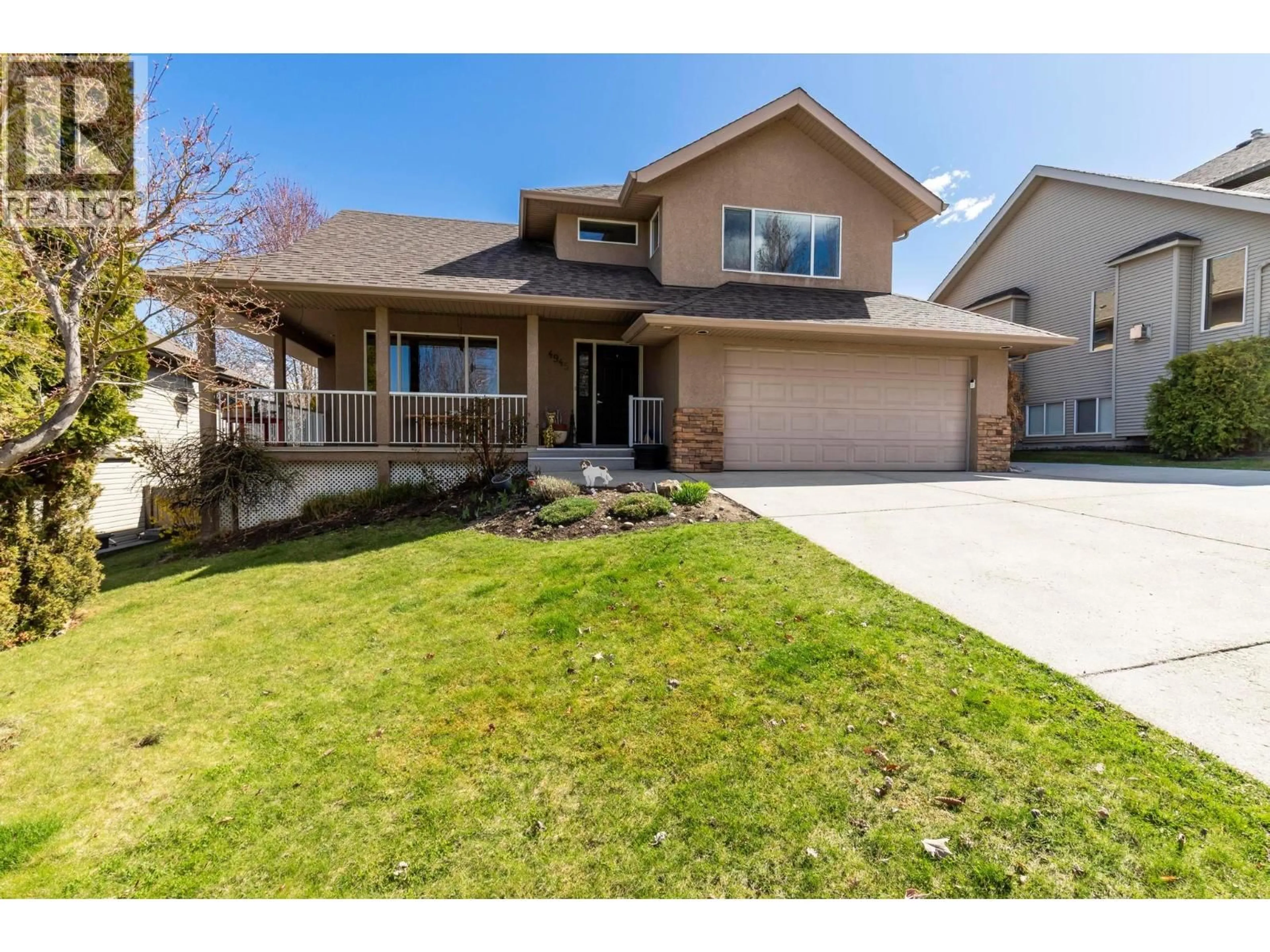 Home with vinyl exterior material, street for 4945 SOUTH RIDGE DRIVE, Kelowna British Columbia V1W4Y2
