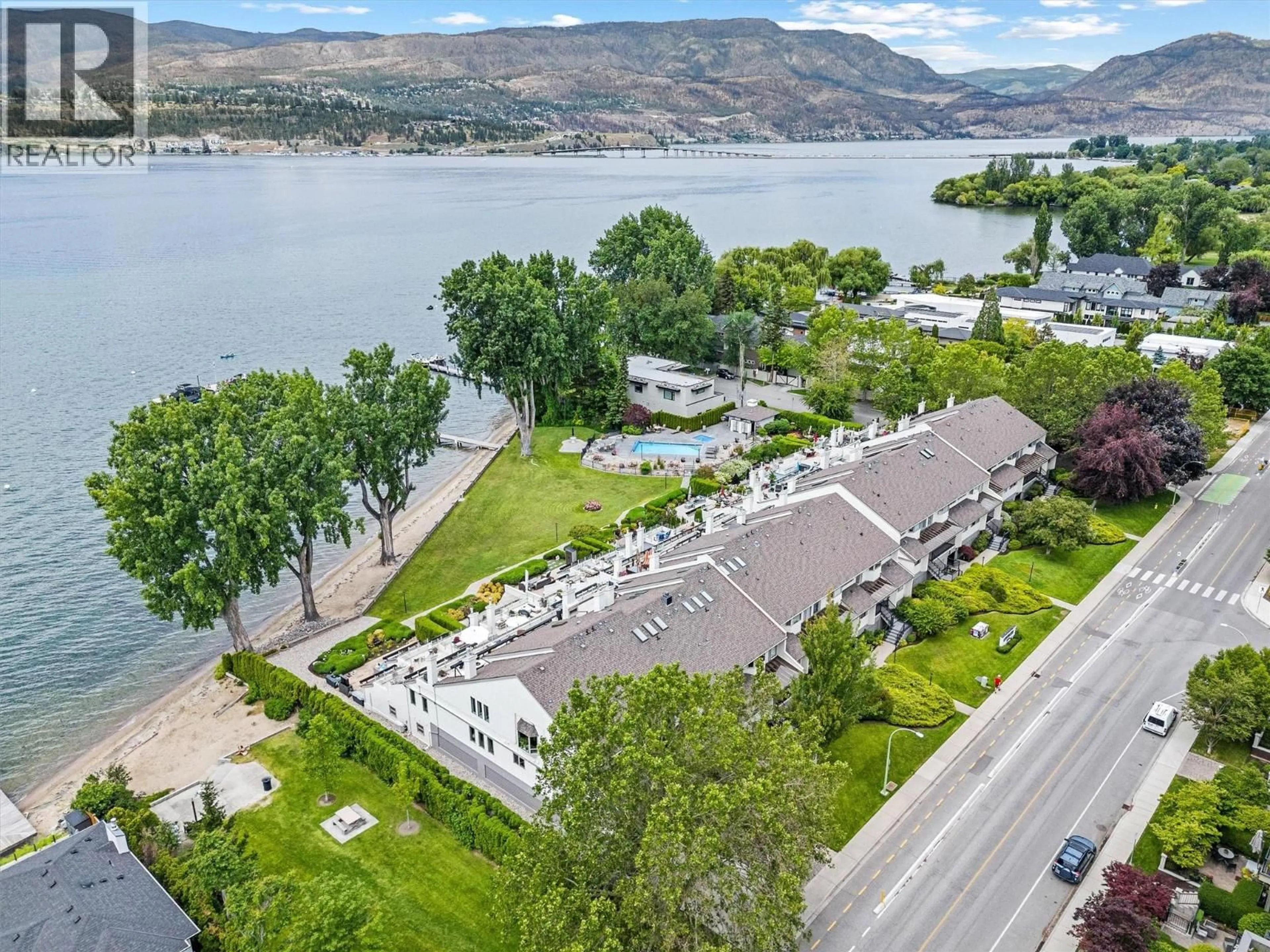 A pic from outside/outdoor area/front of a property/back of a property/a pic from drone, water/lake/river/ocean view for 202 - 2900 ABBOTT STREET, Kelowna British Columbia V1Y1G6