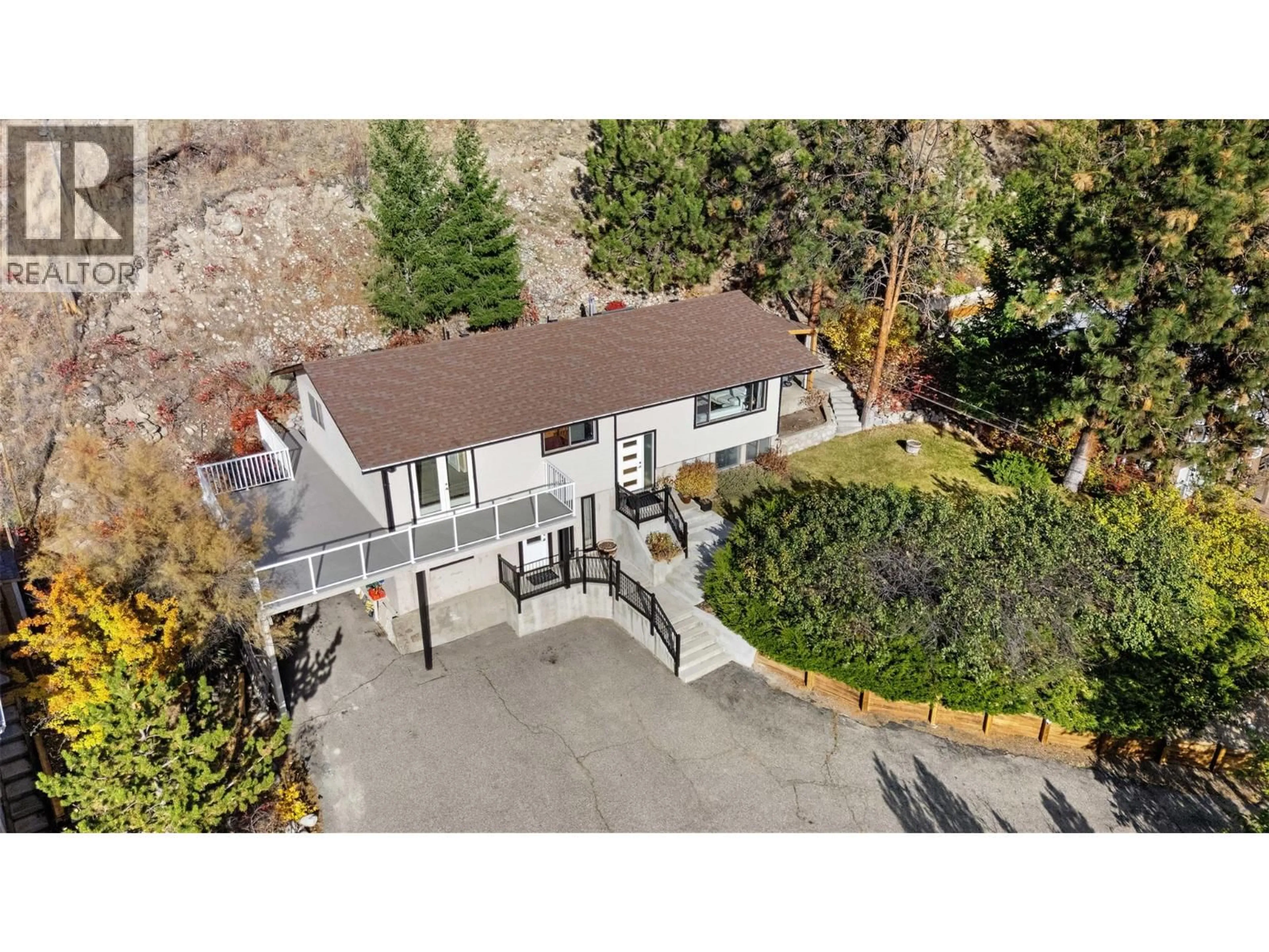 A pic from outside/outdoor area/front of a property/back of a property/a pic from drone, street for 4206 4TH AVENUE, Peachland British Columbia V0H1X5