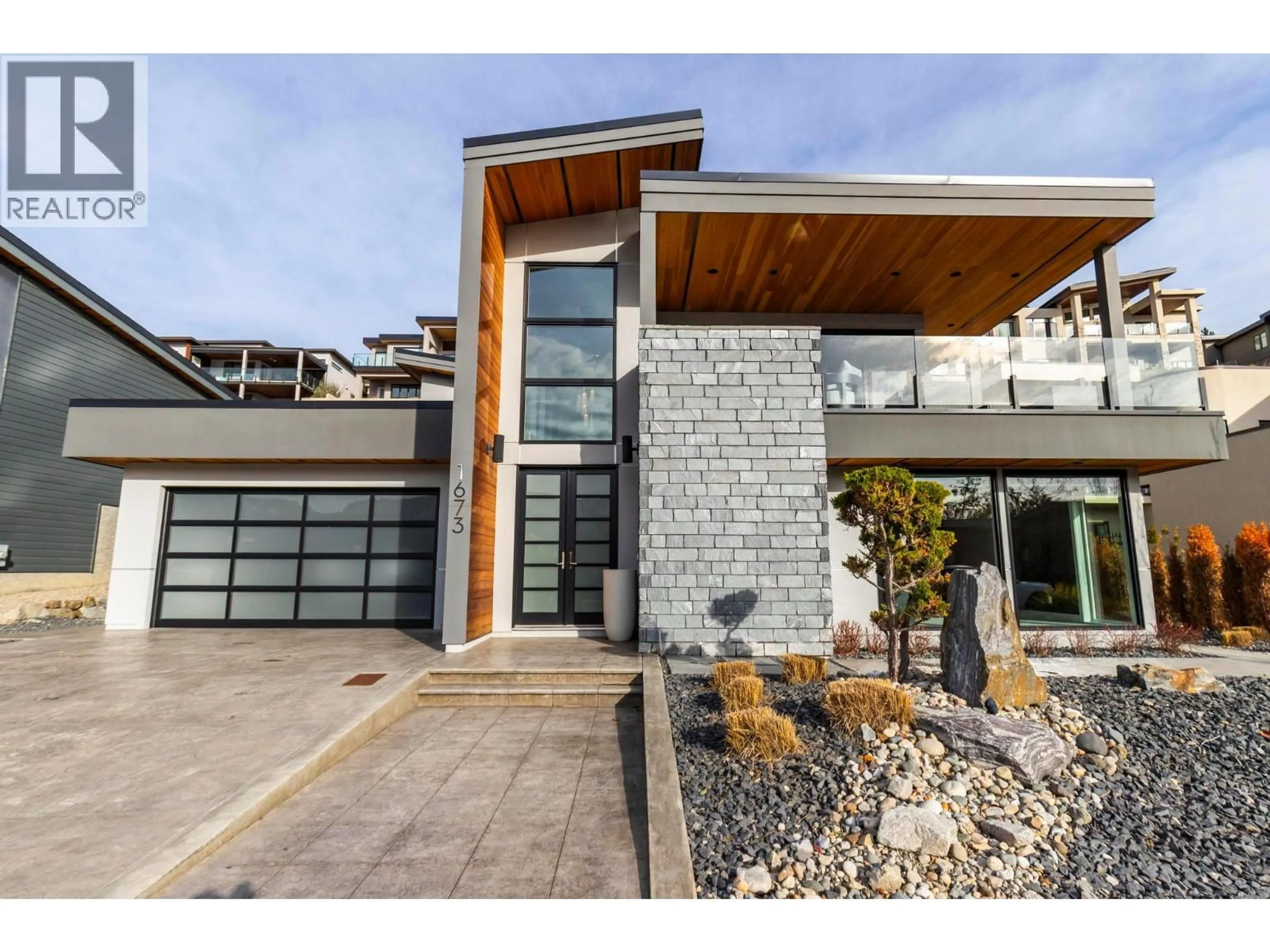 Home with brick exterior material, street for 1673 TRAVERTINE DRIVE, Lake Country British Columbia V4V2T4