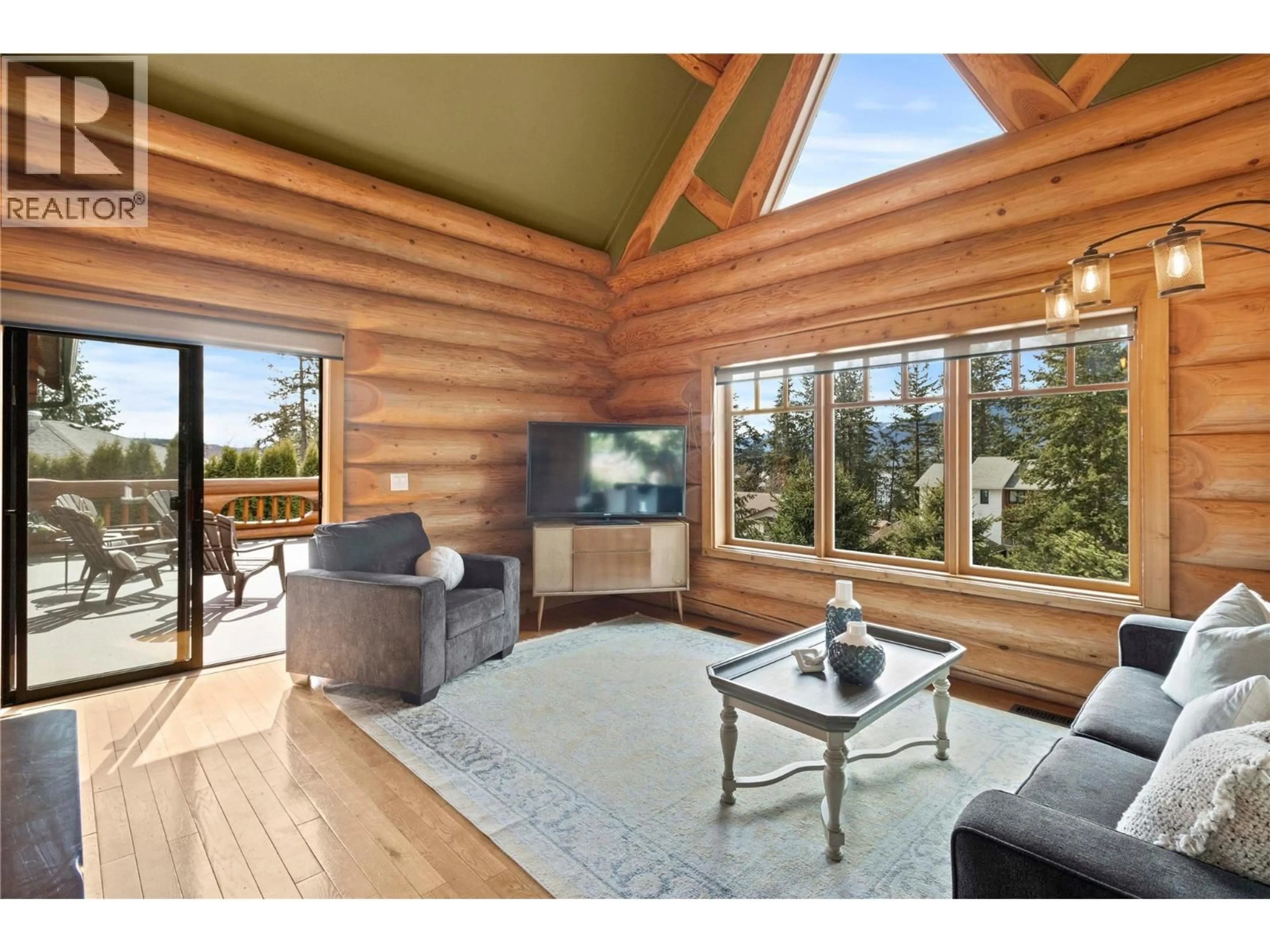 Living room with furniture, wood/laminate floor for 3667 BRAELYN ROAD, Tappen British Columbia V0E2X1