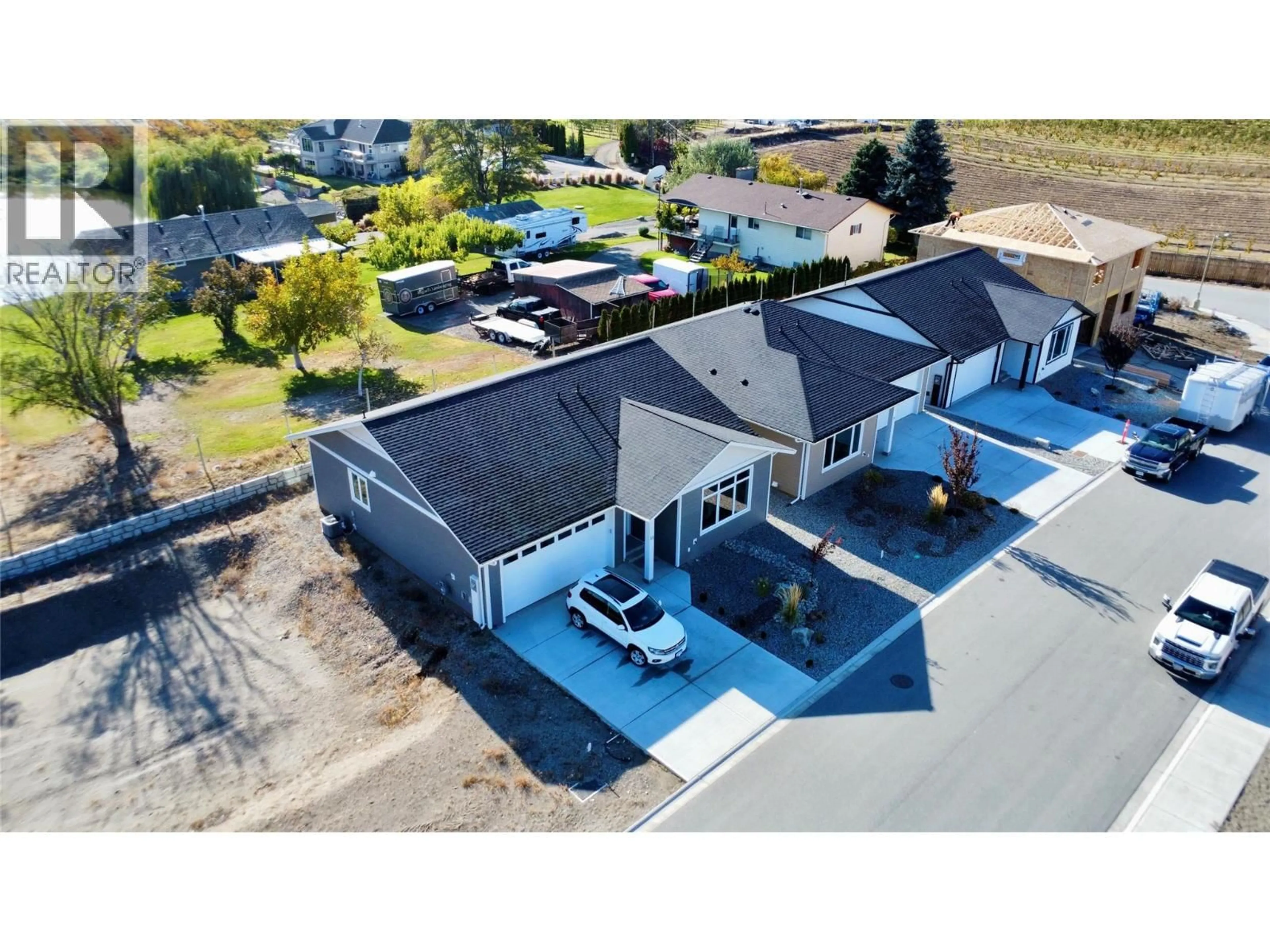 A pic from outside/outdoor area/front of a property/back of a property/a pic from drone, street for 7 WOOD DUCK WAY, Osoyoos British Columbia V0H1V5
