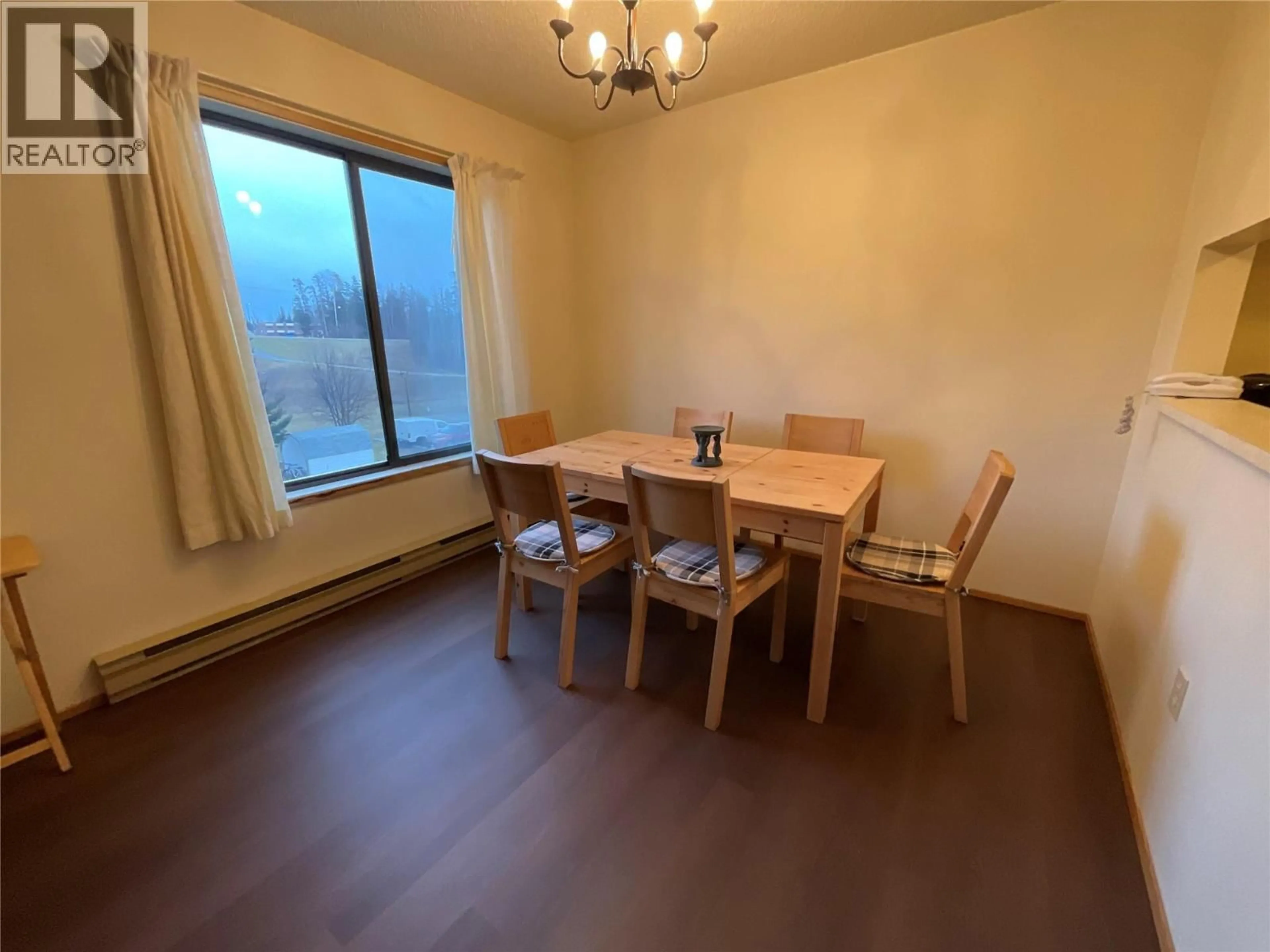 Dining room, wood/laminate floor for 301 - 185 CHAMBERLAIN CRESCENT, Tumbler Ridge British Columbia V0C2W0