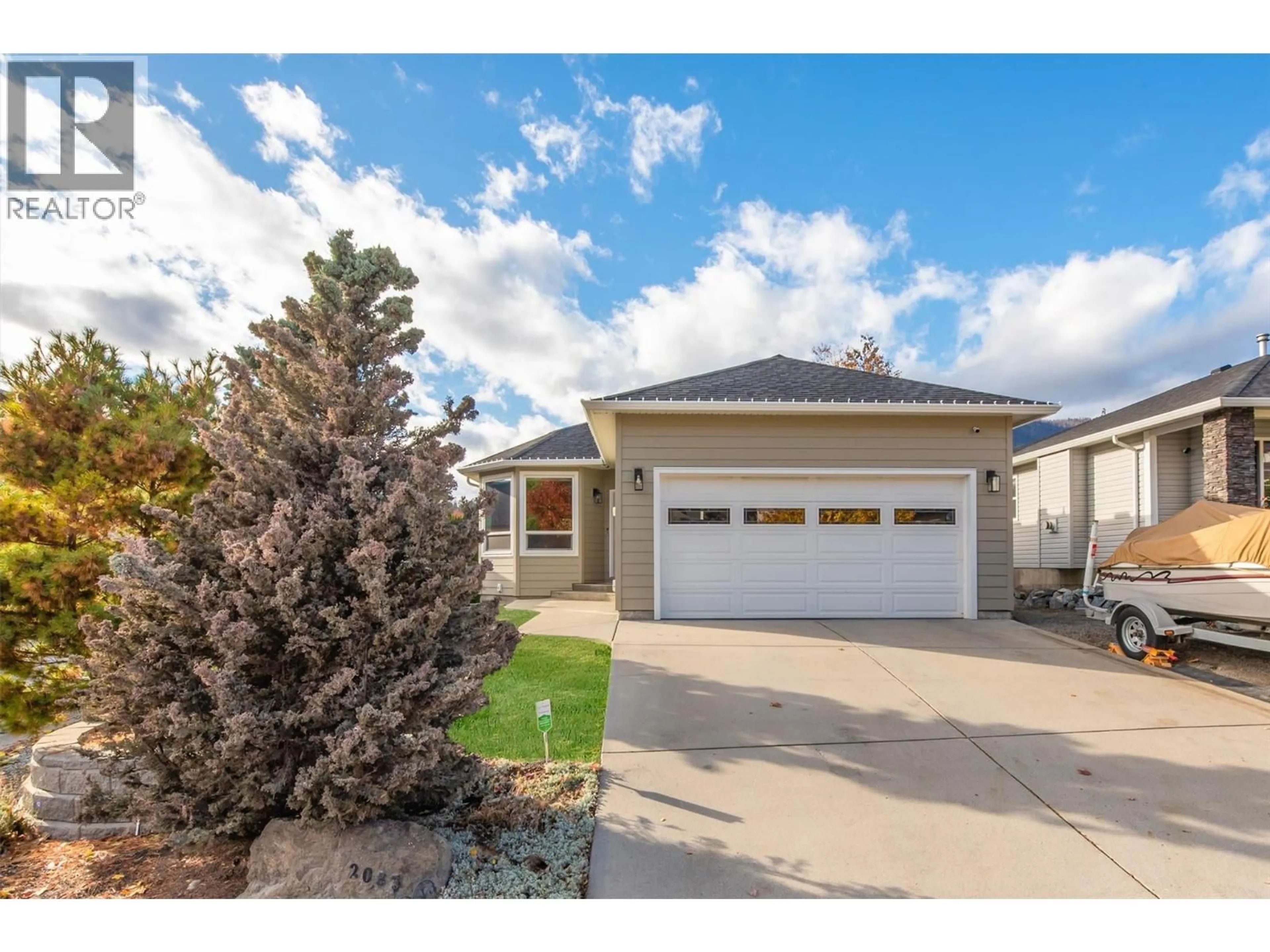 Home with vinyl exterior material, street for 2083 ROSEFIELD DRIVE, West Kelowna British Columbia V1Z3Y8