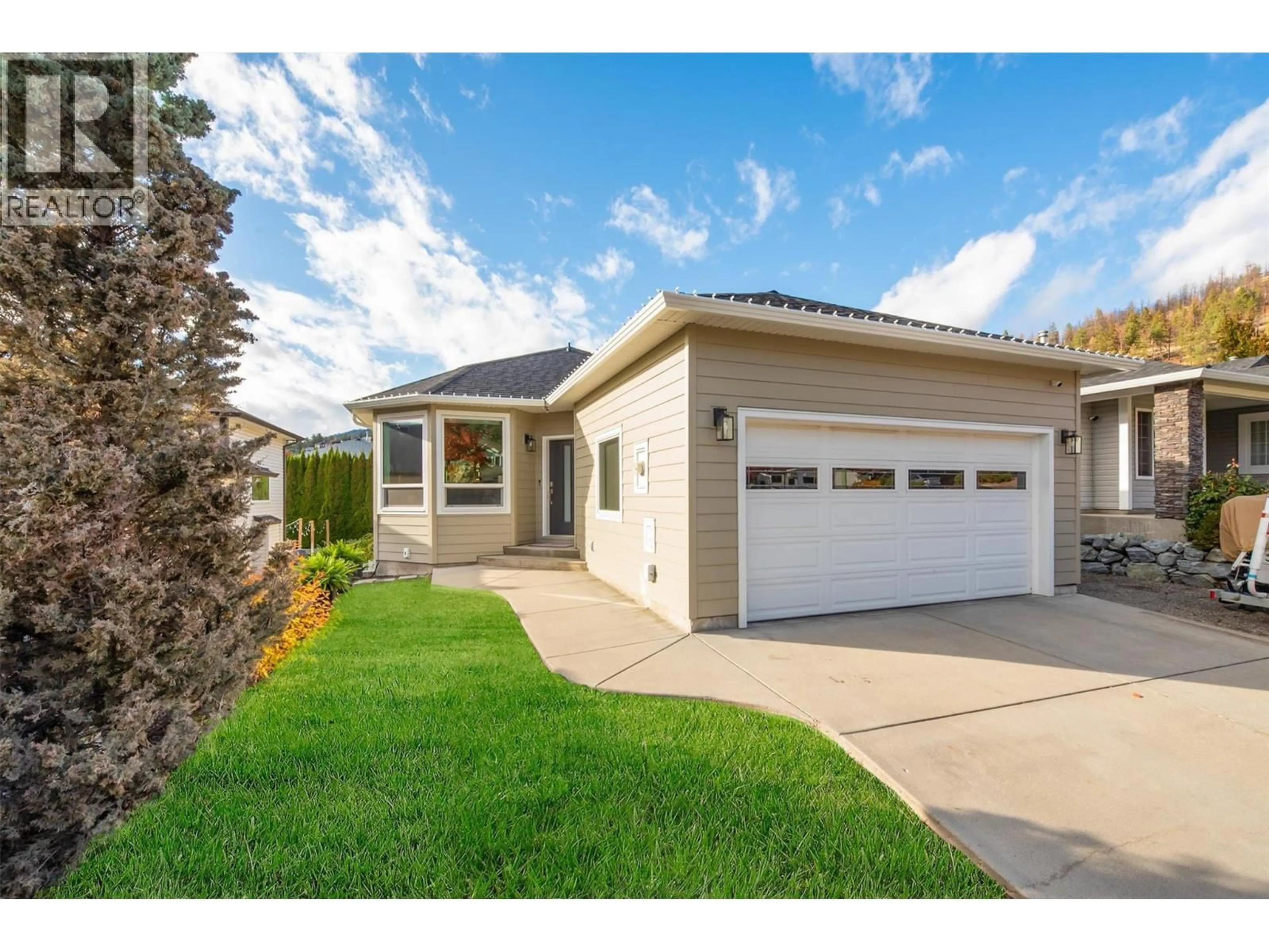 Home with vinyl exterior material, street for 2083 ROSEFIELD DRIVE, West Kelowna British Columbia V1Z3Y8