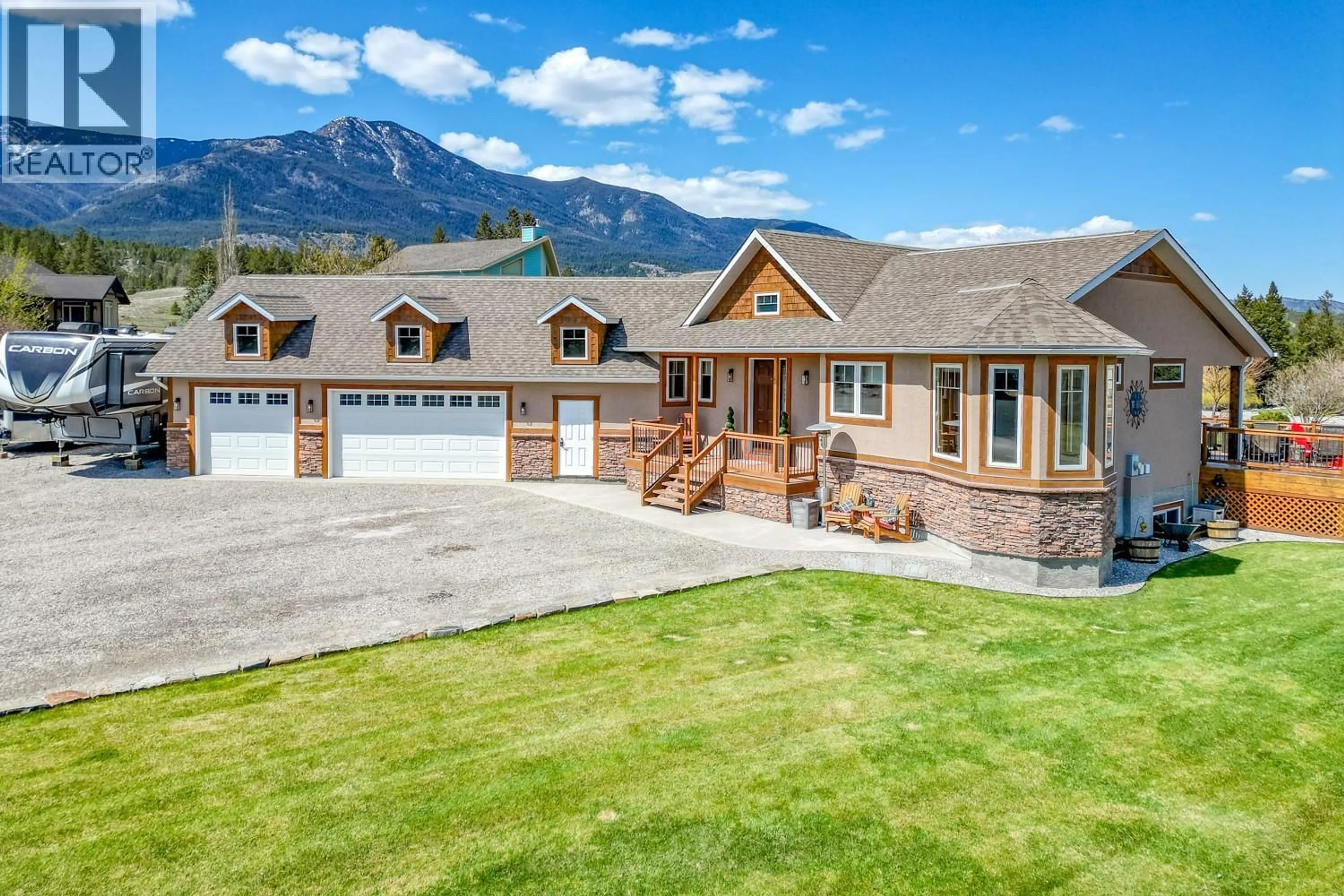 A pic from outside/outdoor area/front of a property/back of a property/a pic from drone, mountain view for 4453 CEDAR BAY, Fairmont Hot Springs British Columbia V0B1L2