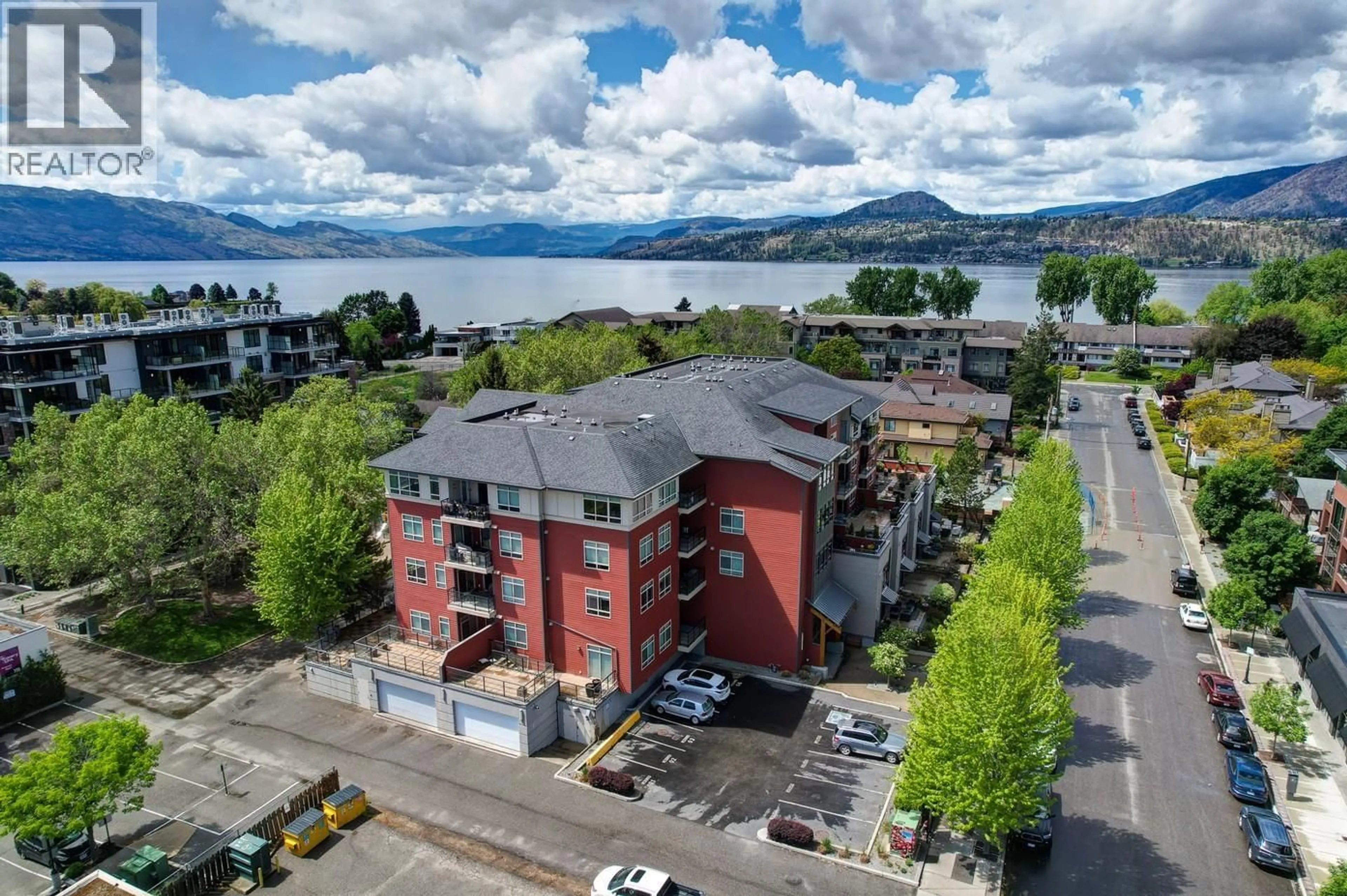 A pic from outside/outdoor area/front of a property/back of a property/a pic from drone, water/lake/river/ocean view for 111 - 457 WEST AVENUE, Kelowna British Columbia V1Y4Z3