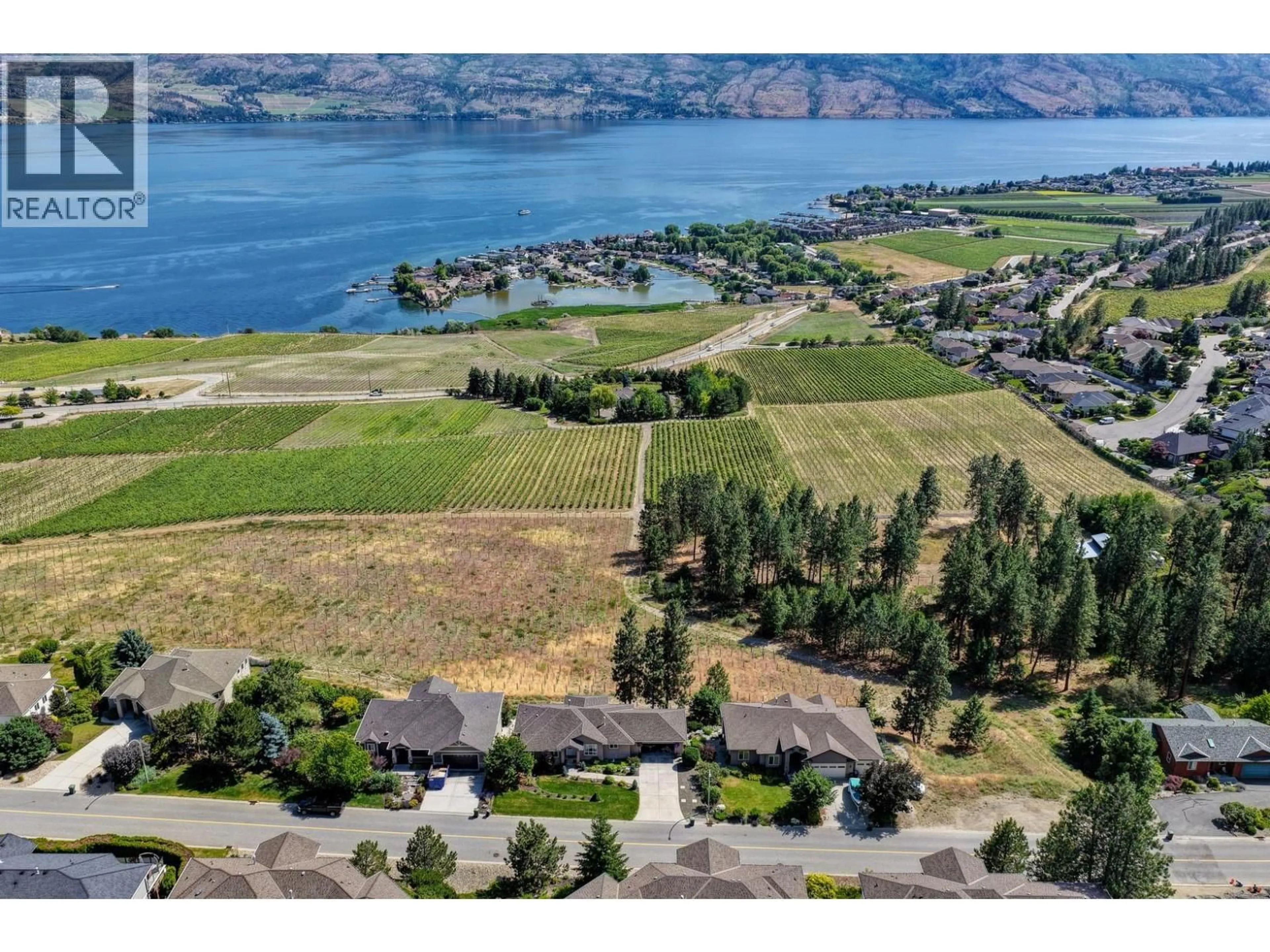 A pic from outside/outdoor area/front of a property/back of a property/a pic from drone, water/lake/river/ocean view for 1395 GREGORY ROAD, West Kelowna British Columbia V1Z3P2