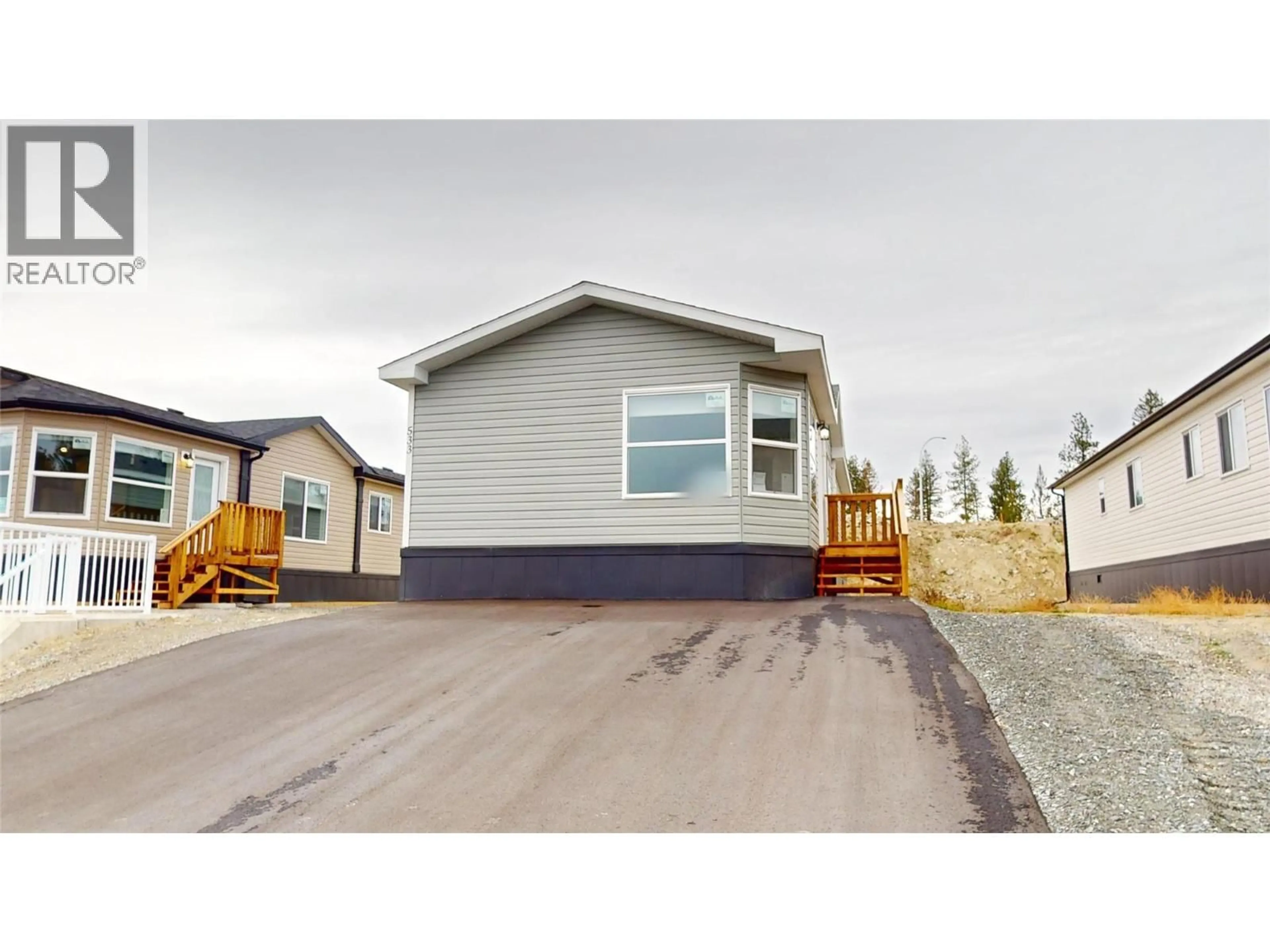 Home with vinyl exterior material, street for 533 STEEPLEVIEW AVENUE NORTHWEST, Cranbrook British Columbia V1C5L3