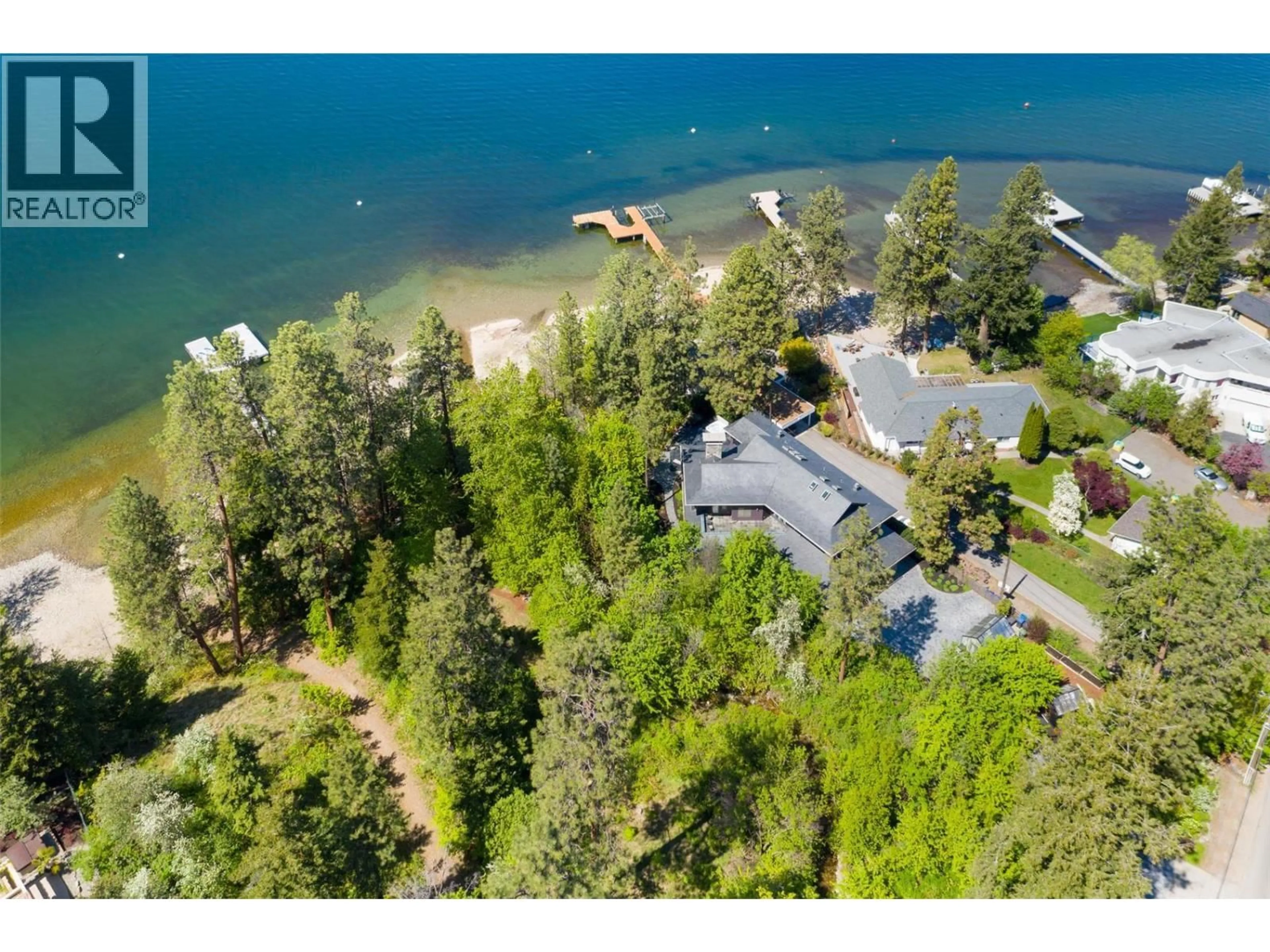 A pic from outside/outdoor area/front of a property/back of a property/a pic from drone, water/lake/river/ocean view for 5308 LAKESHORE ROAD, Kelowna British Columbia V1W4J3