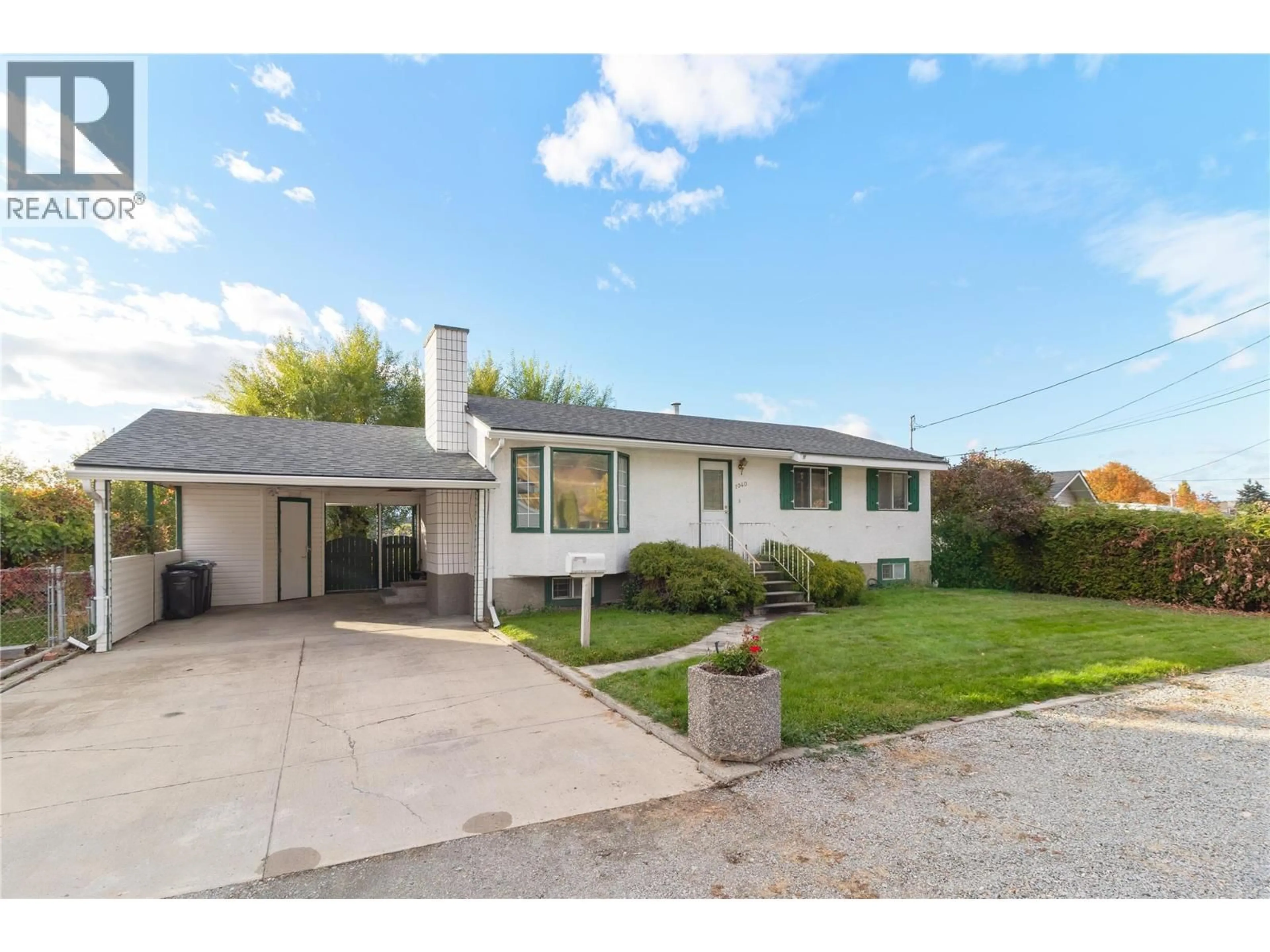 Home with vinyl exterior material, street for 1040 CACTUS ROAD, Kelowna British Columbia V1X3N7