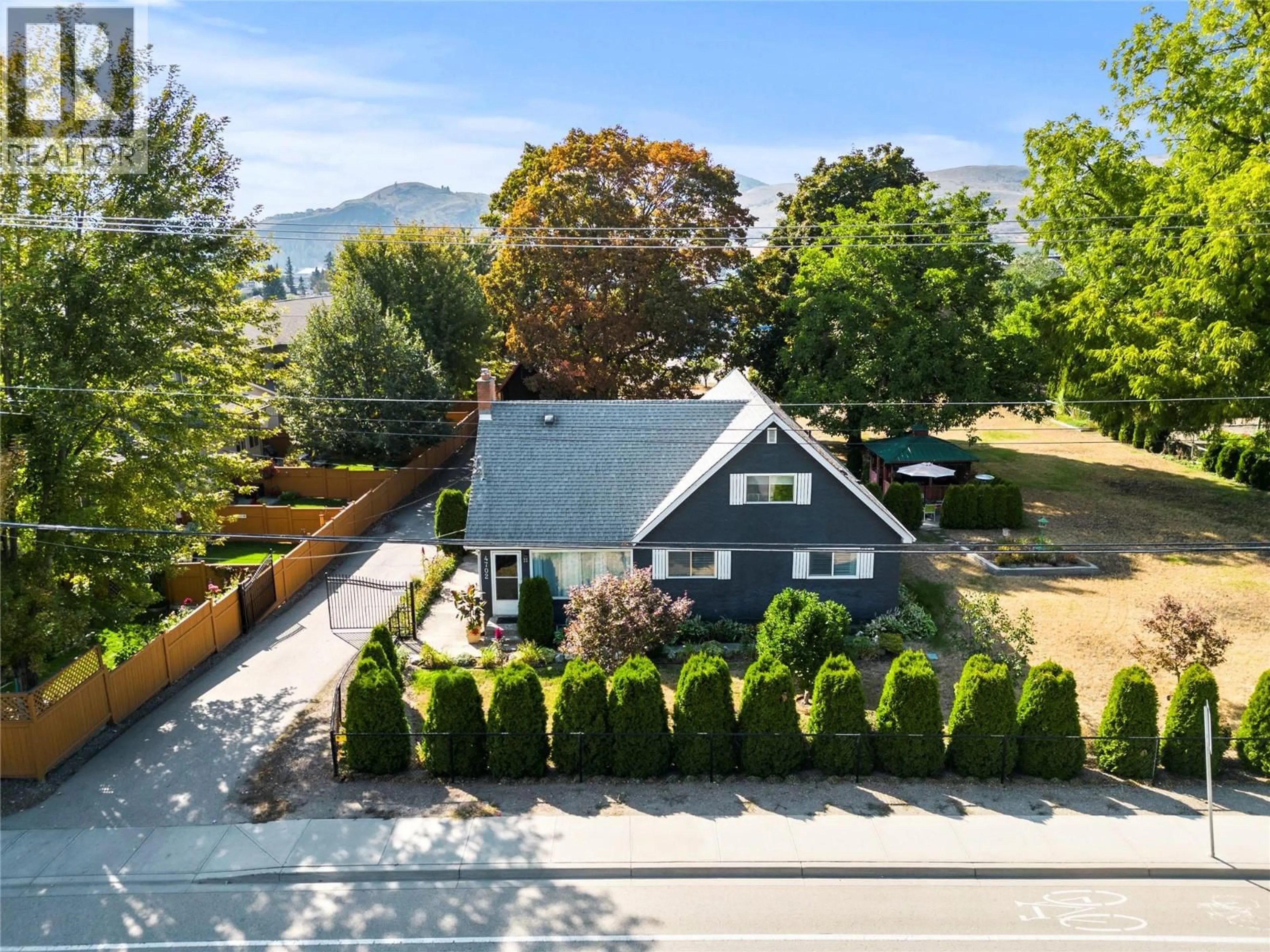 A pic from outside/outdoor area/front of a property/back of a property/a pic from drone, mountain view for 4702 20 STREET, Vernon British Columbia V1T4E5