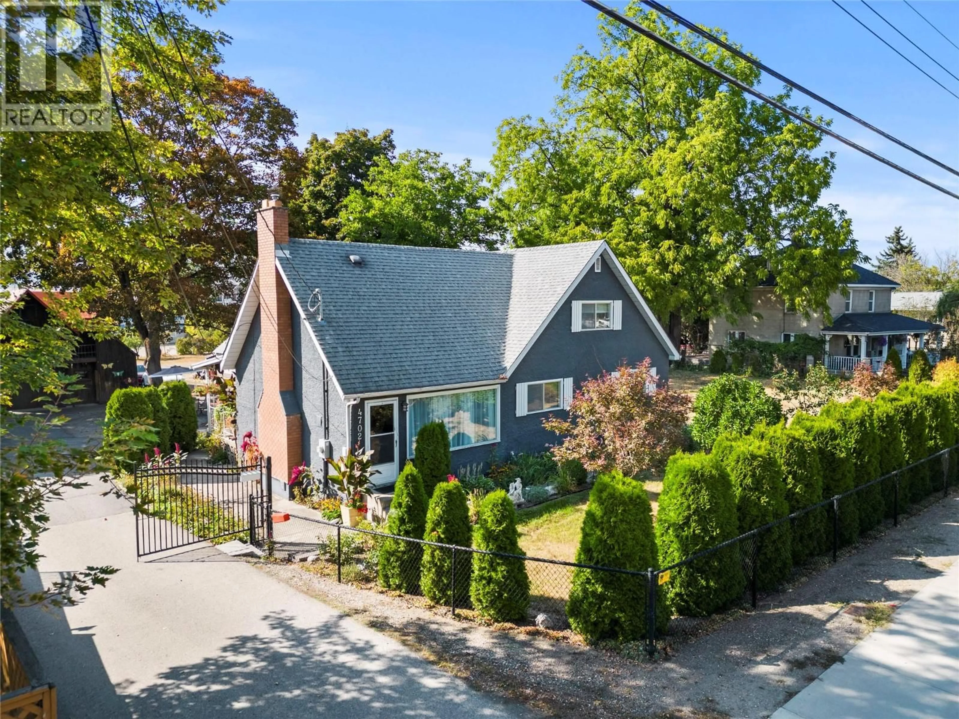 A pic from outside/outdoor area/front of a property/back of a property/a pic from drone, street for 4702 20 STREET, Vernon British Columbia V1T4E5