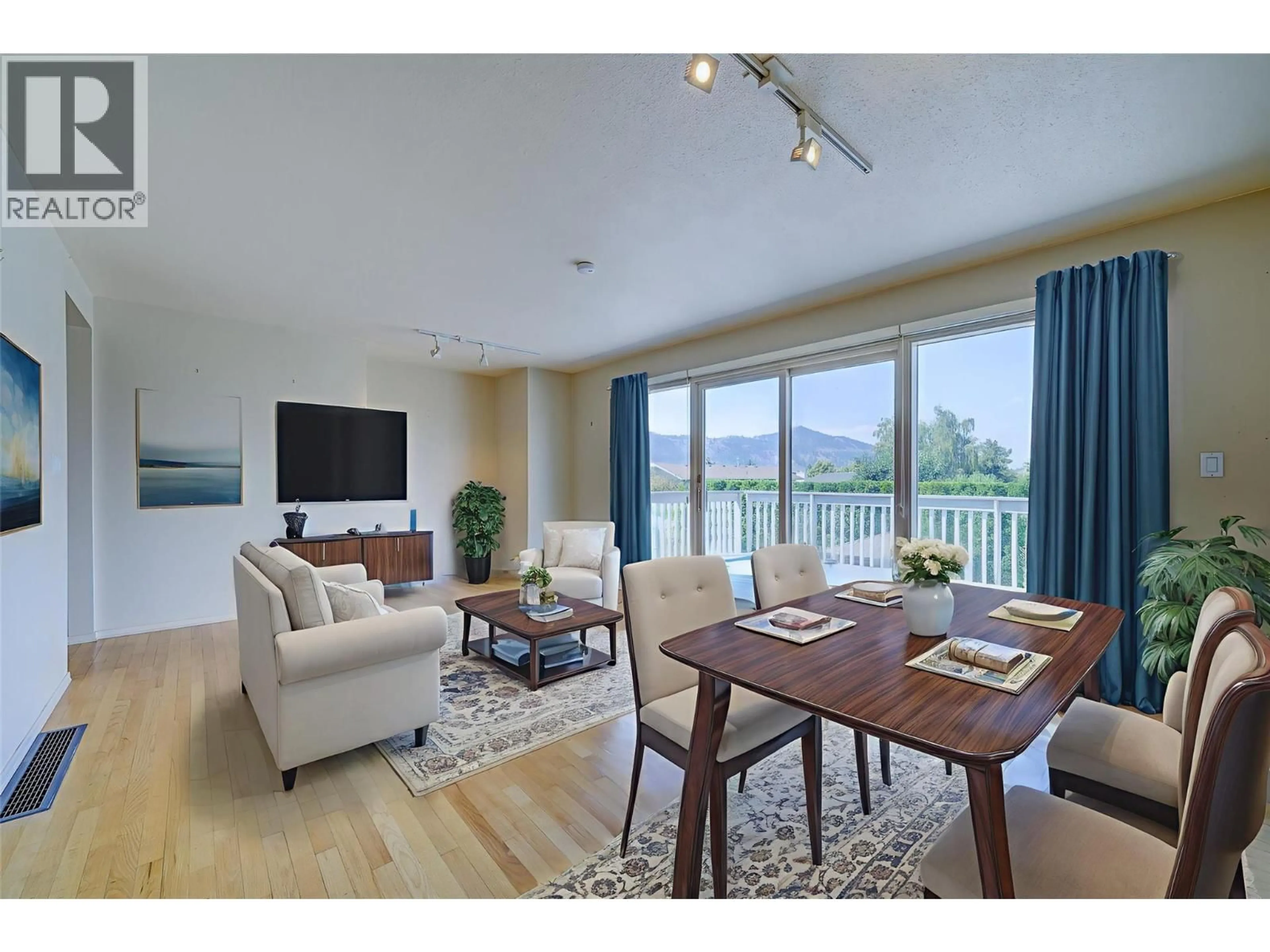 Living room with furniture, wood/laminate floor for 1262 GIBRALTAR WYND, Kamloops British Columbia V2C1S7