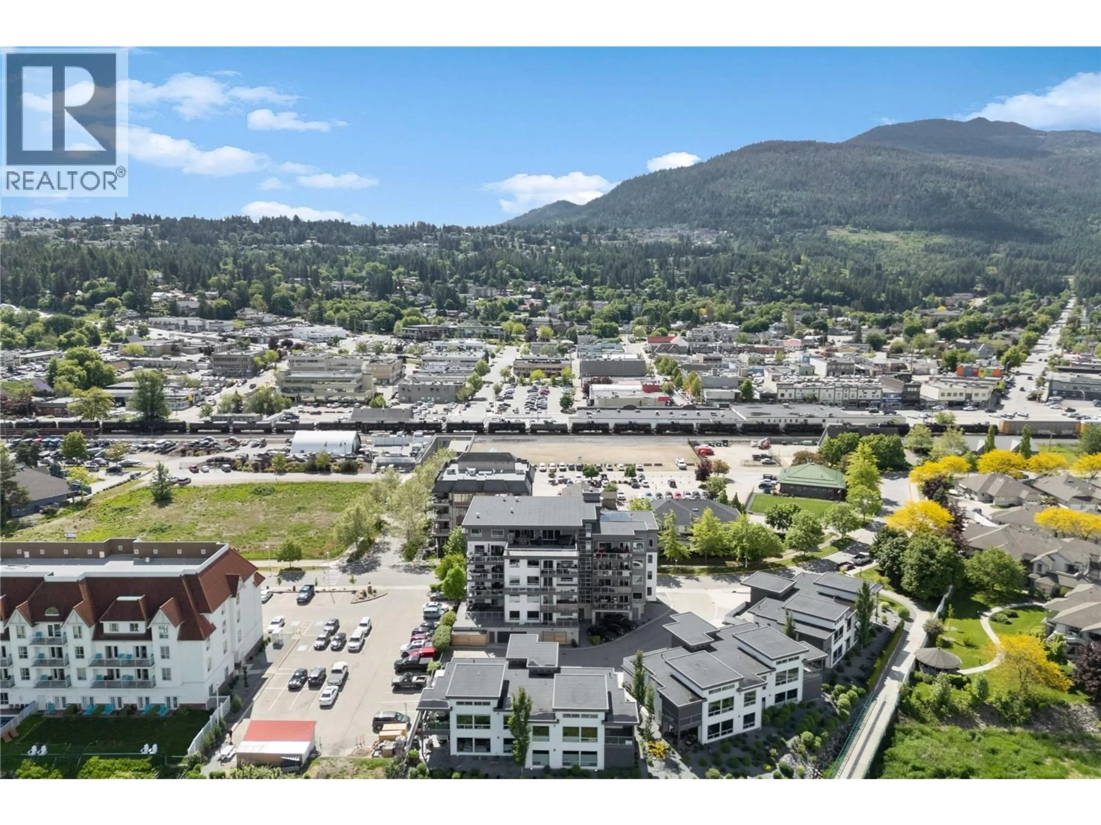 A pic from outside/outdoor area/front of a property/back of a property/a pic from drone, mountain view for 302 - 131 HARBOURFRONT DRIVE NORTHEAST, Salmon Arm British Columbia V1E0G4