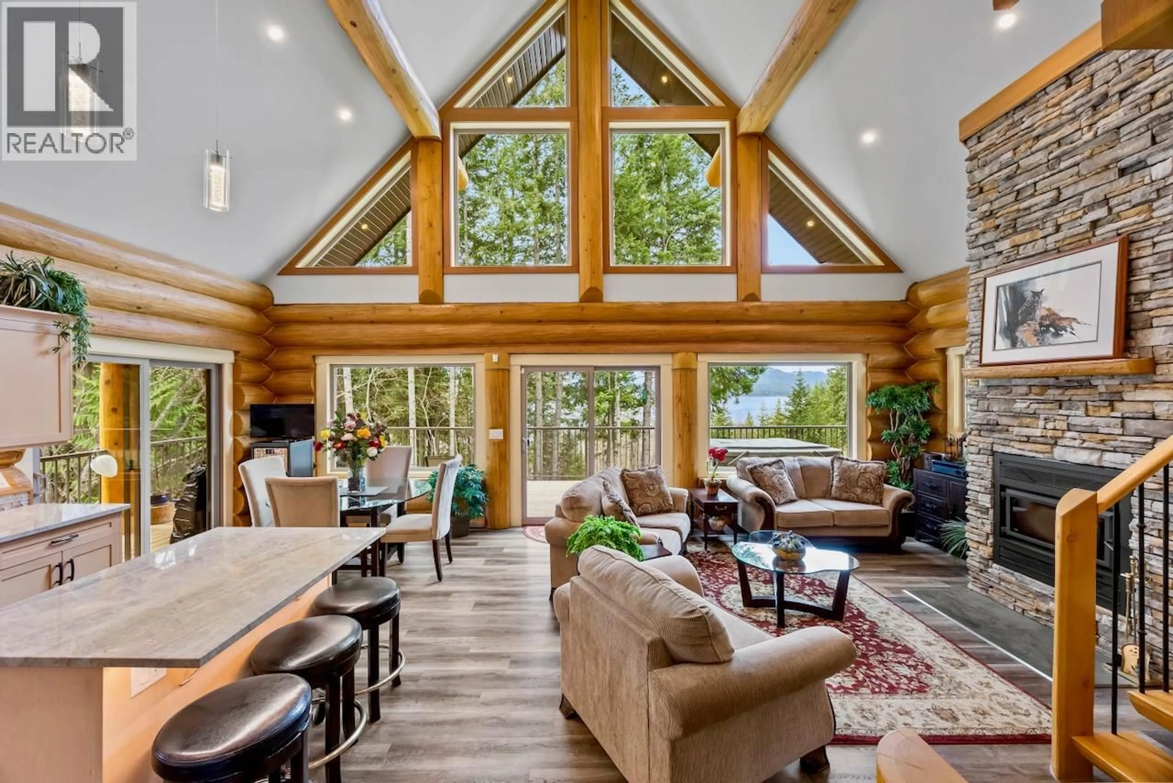 Living room with furniture, wood/laminate floor for 2589 AIRSTRIP ROAD, Anglemont British Columbia V0E1M8