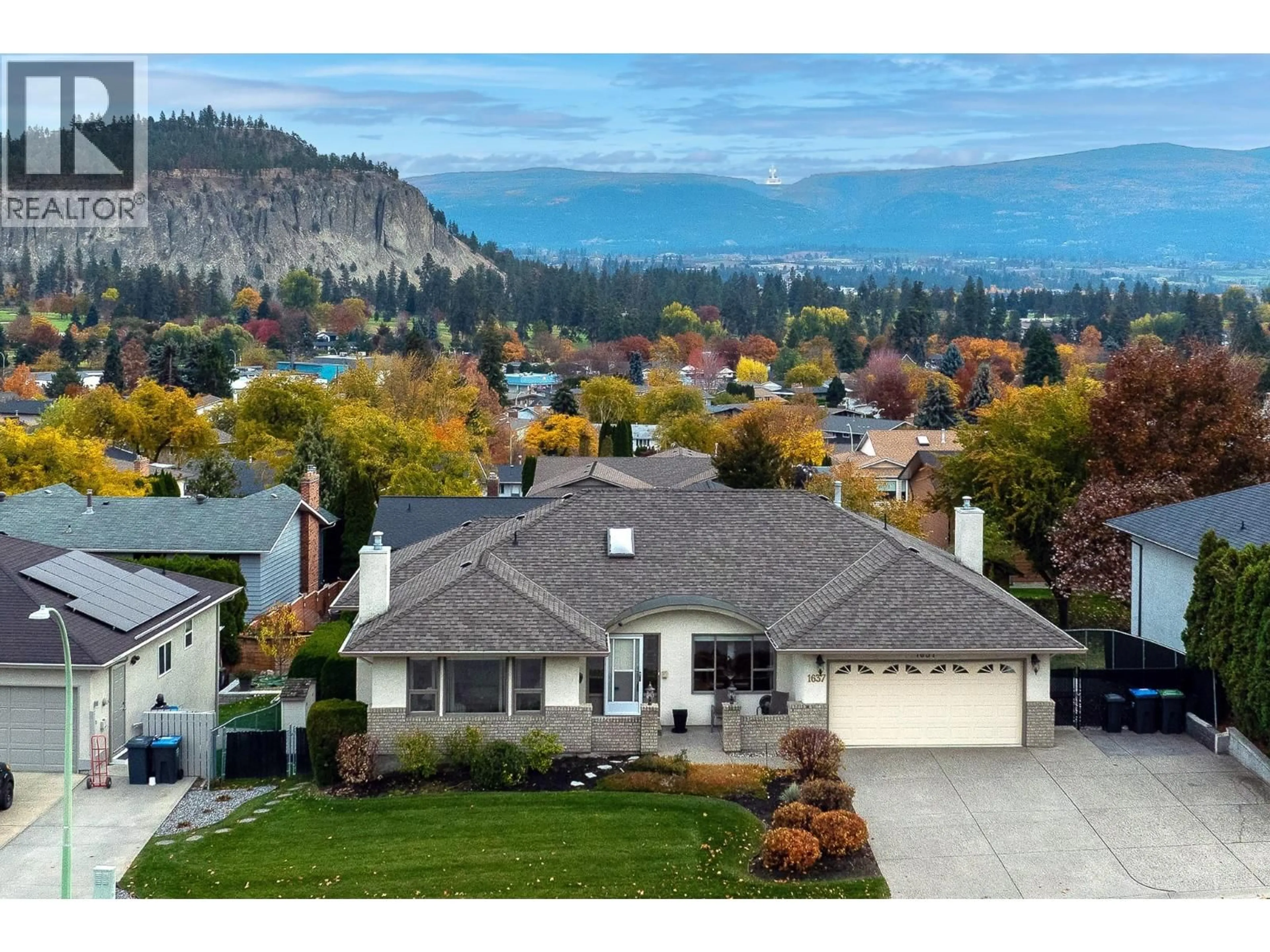 A pic from outside/outdoor area/front of a property/back of a property/a pic from drone, mountain view for 1637 SONORA DRIVE, Kelowna British Columbia V1Y8Z2
