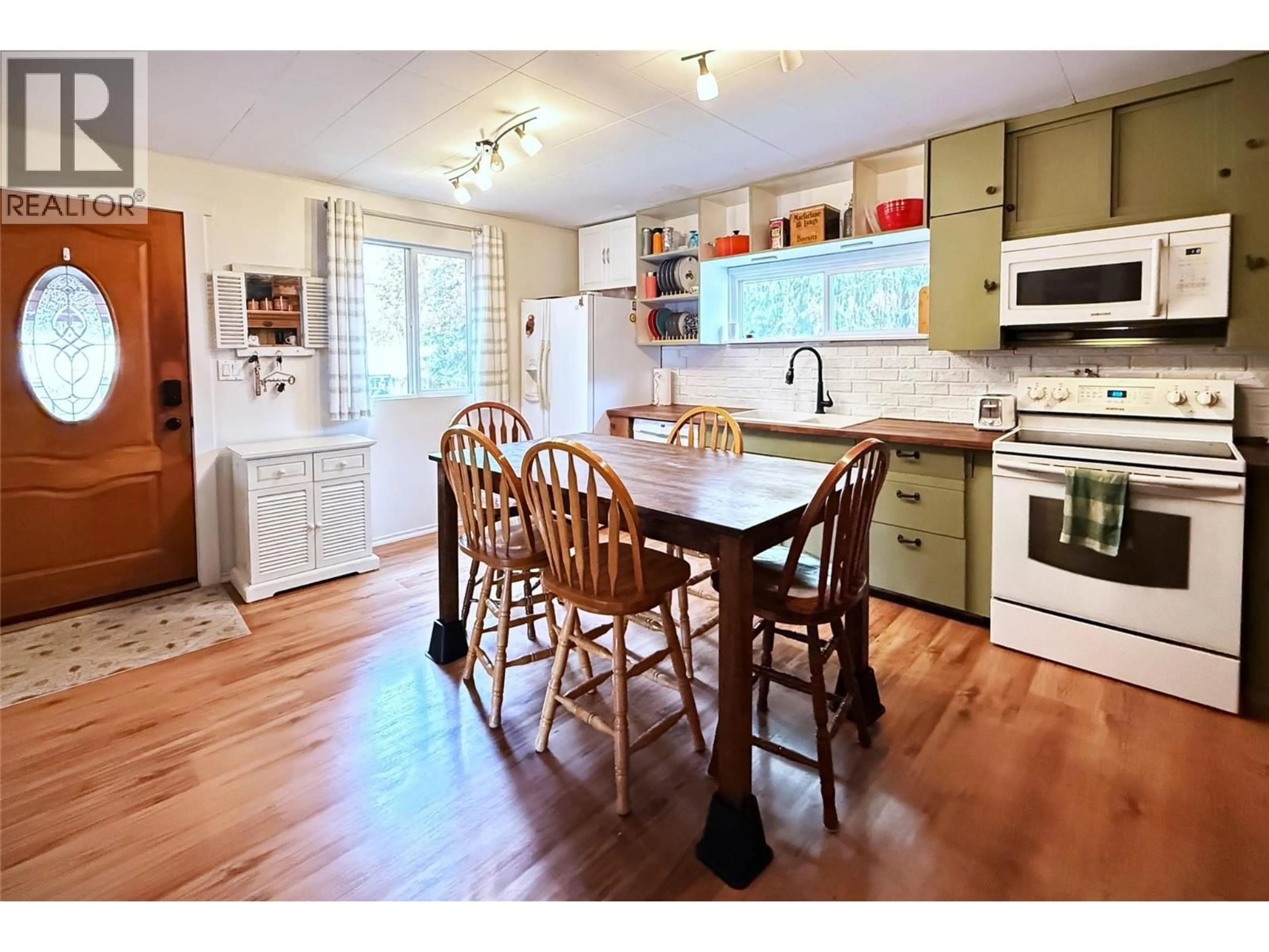 Open concept kitchen, wood/laminate floor for 7310 51 STREET NORTHEAST, Salmon Arm British Columbia V0E1K0