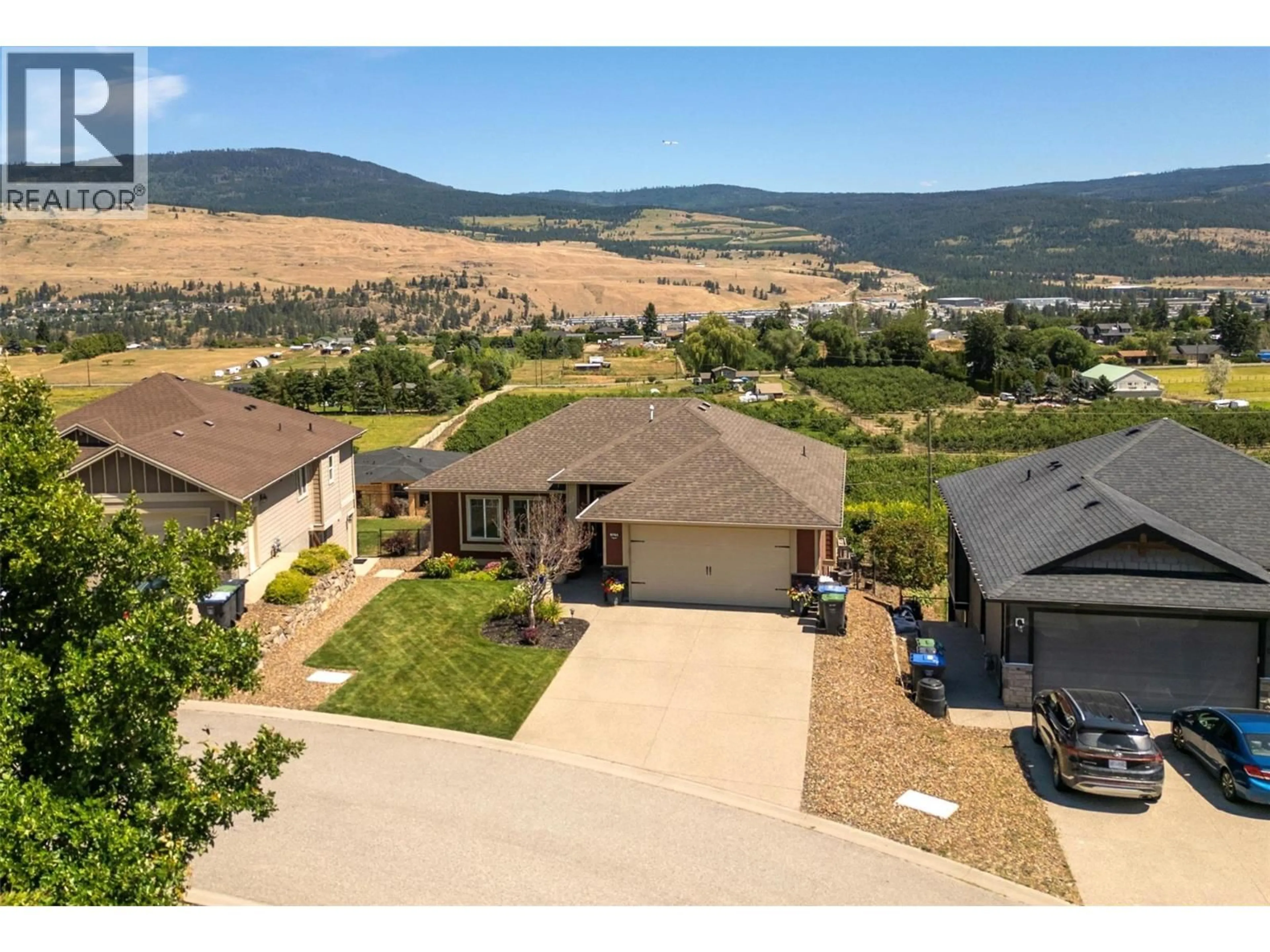 A pic from outside/outdoor area/front of a property/back of a property/a pic from drone, mountain view for 9761 CROFTON ROAD, Lake Country British Columbia V4V2S1