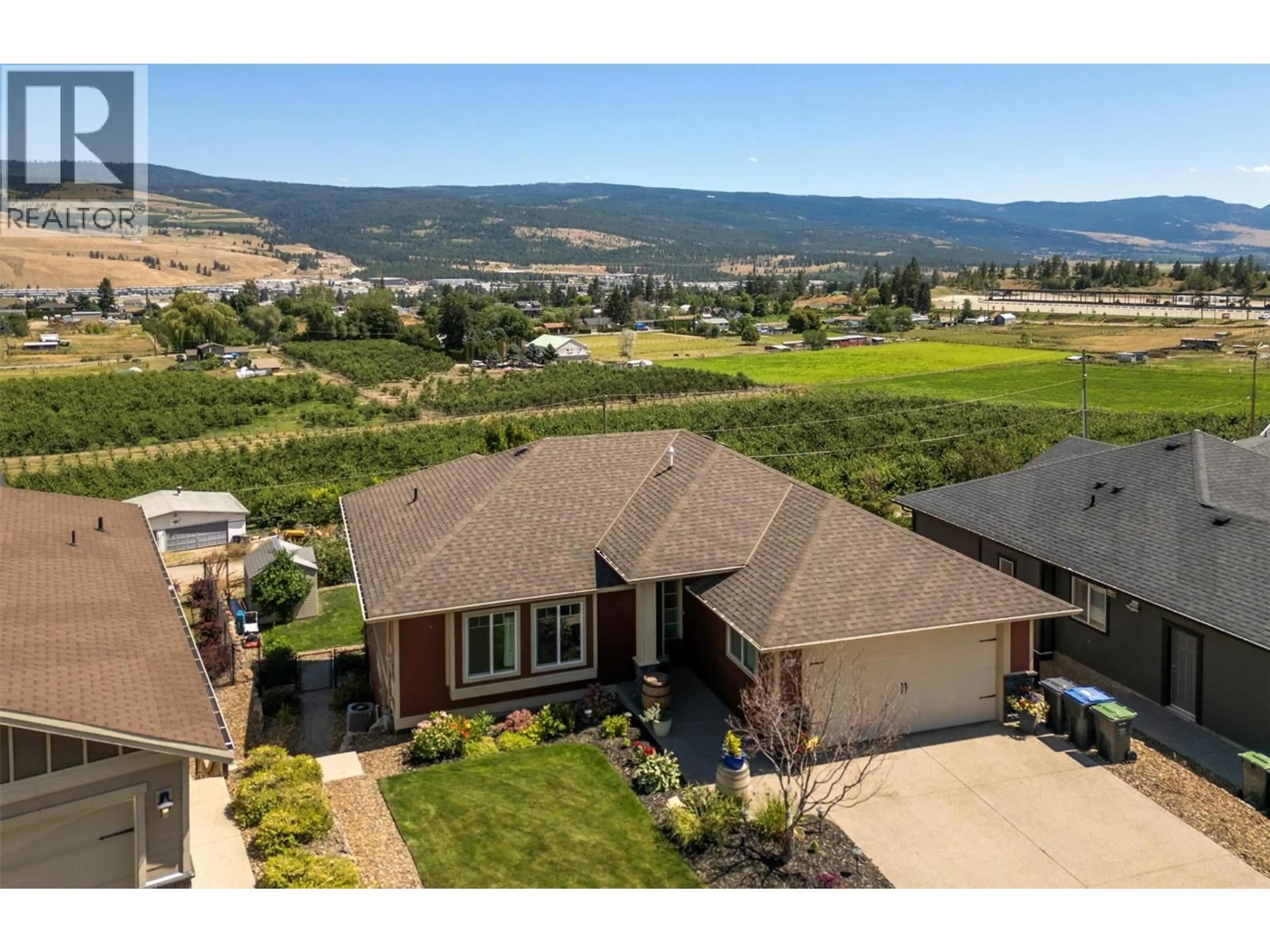 A pic from outside/outdoor area/front of a property/back of a property/a pic from drone, mountain view for 9761 CROFTON ROAD, Lake Country British Columbia V4V2S1