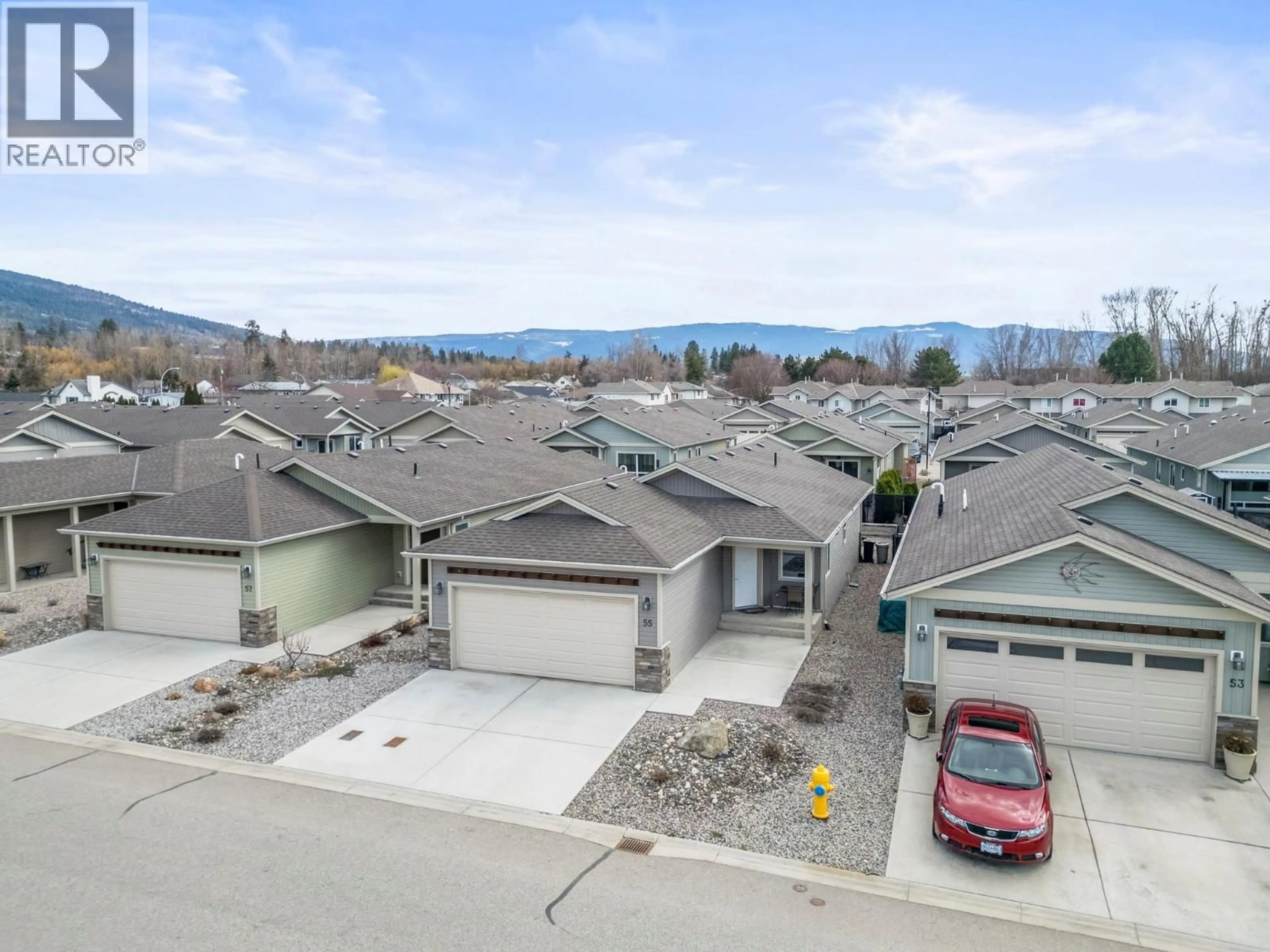 A pic from outside/outdoor area/front of a property/back of a property/a pic from drone, mountain view for 55 - 2100 55 AVENUE, Vernon British Columbia V1T9Y6