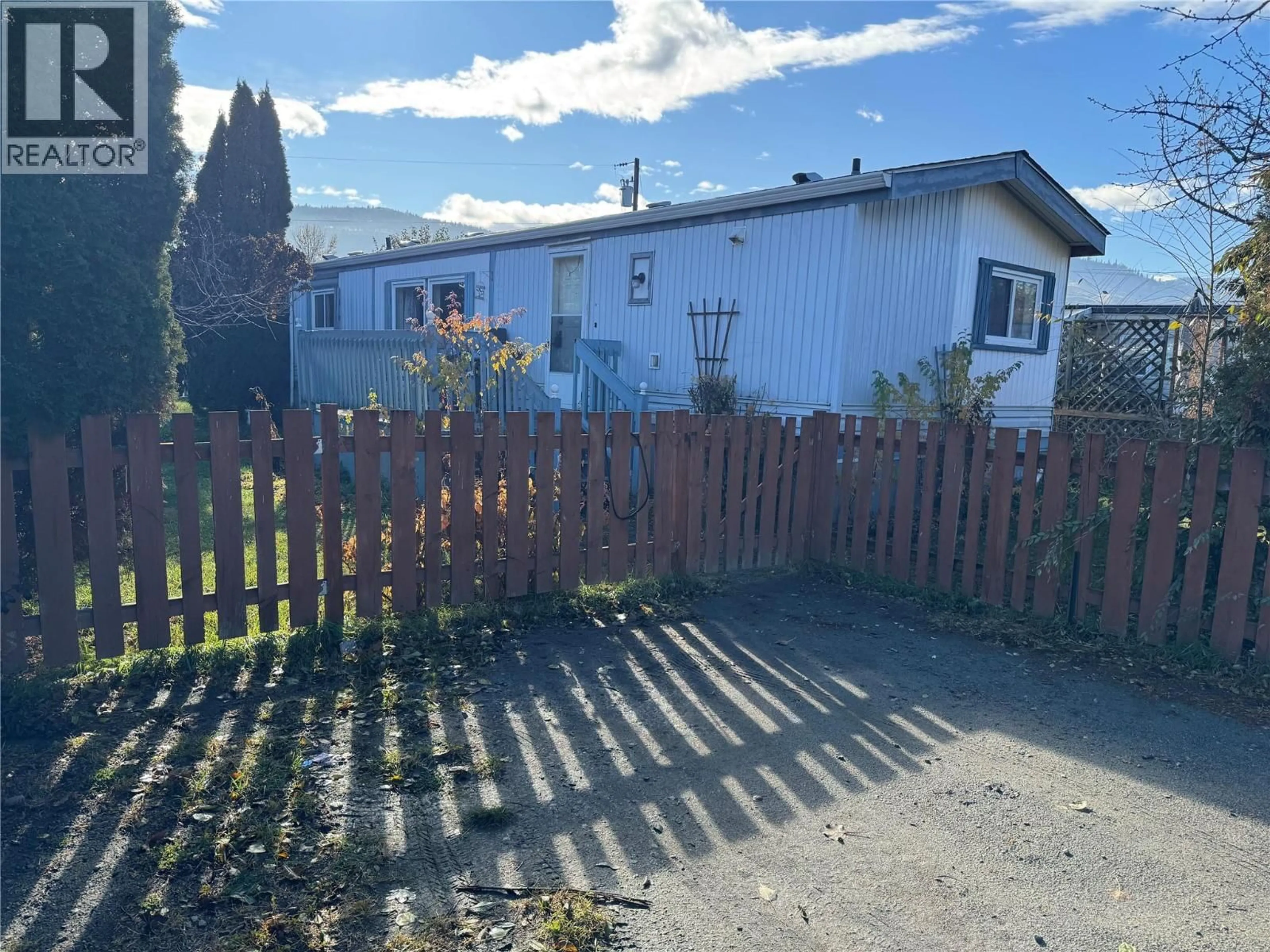 A pic from outside/outdoor area/front of a property/back of a property/a pic from drone, unknown for A14 - 220 G & M ROAD, Kamloops British Columbia V2H1A4